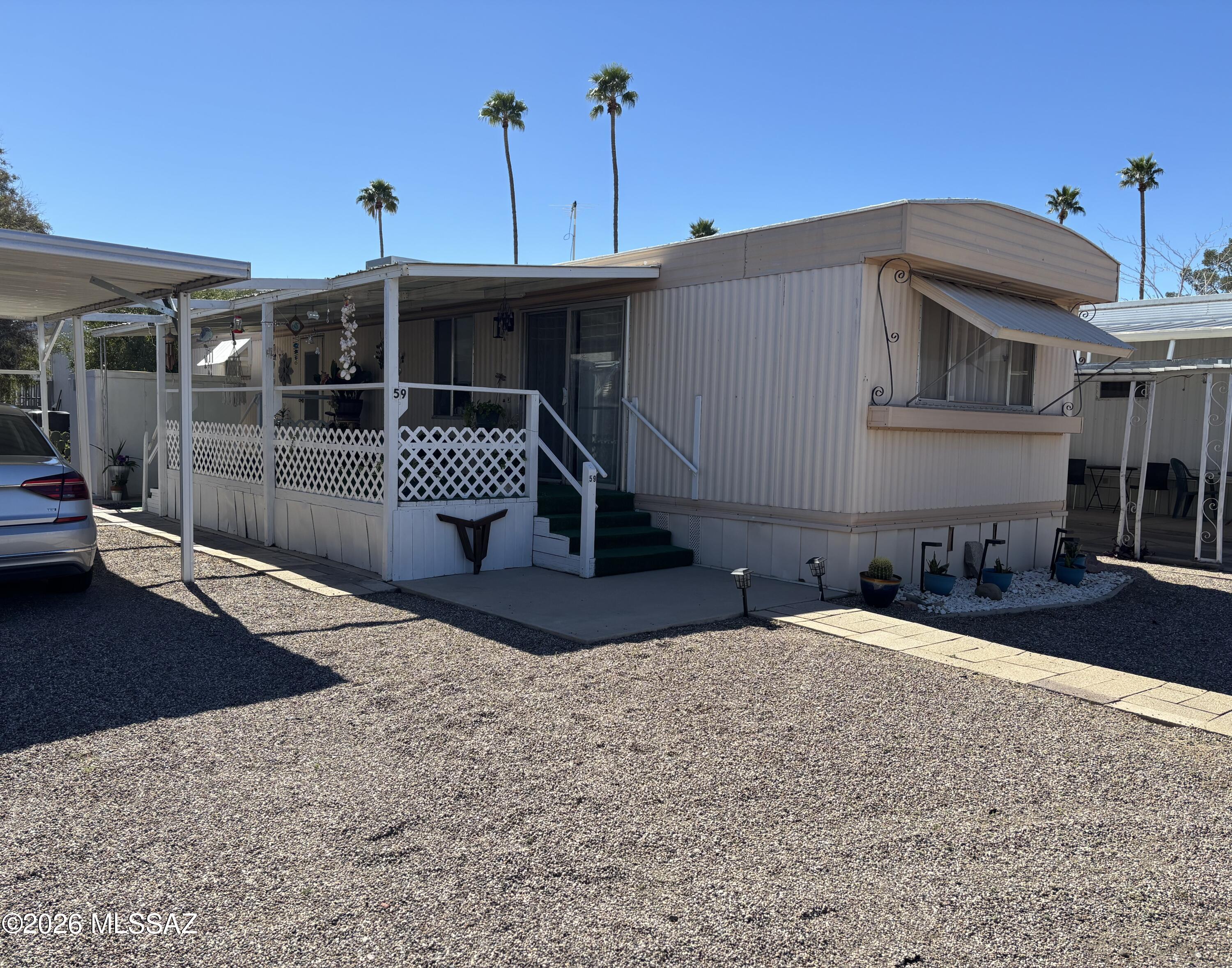 Welcome to easy living in this well-kept home located in a desirable 55+ community! This charming property has been lovingly maintained and offers a comfortable, low-maintenance lifestyle perfect for enjoying your next chapter. You'll appreciate the covered parking for added convenience and protection from the Arizona sun, along with a spacious storage shed -- ideal for tools, hobbies, or extra belongings and a screened-in patio. The community features a swimming pool, recreation center, putting green, and shuffleboard courts -- perfect for staying active, social, and connected with neighbors.