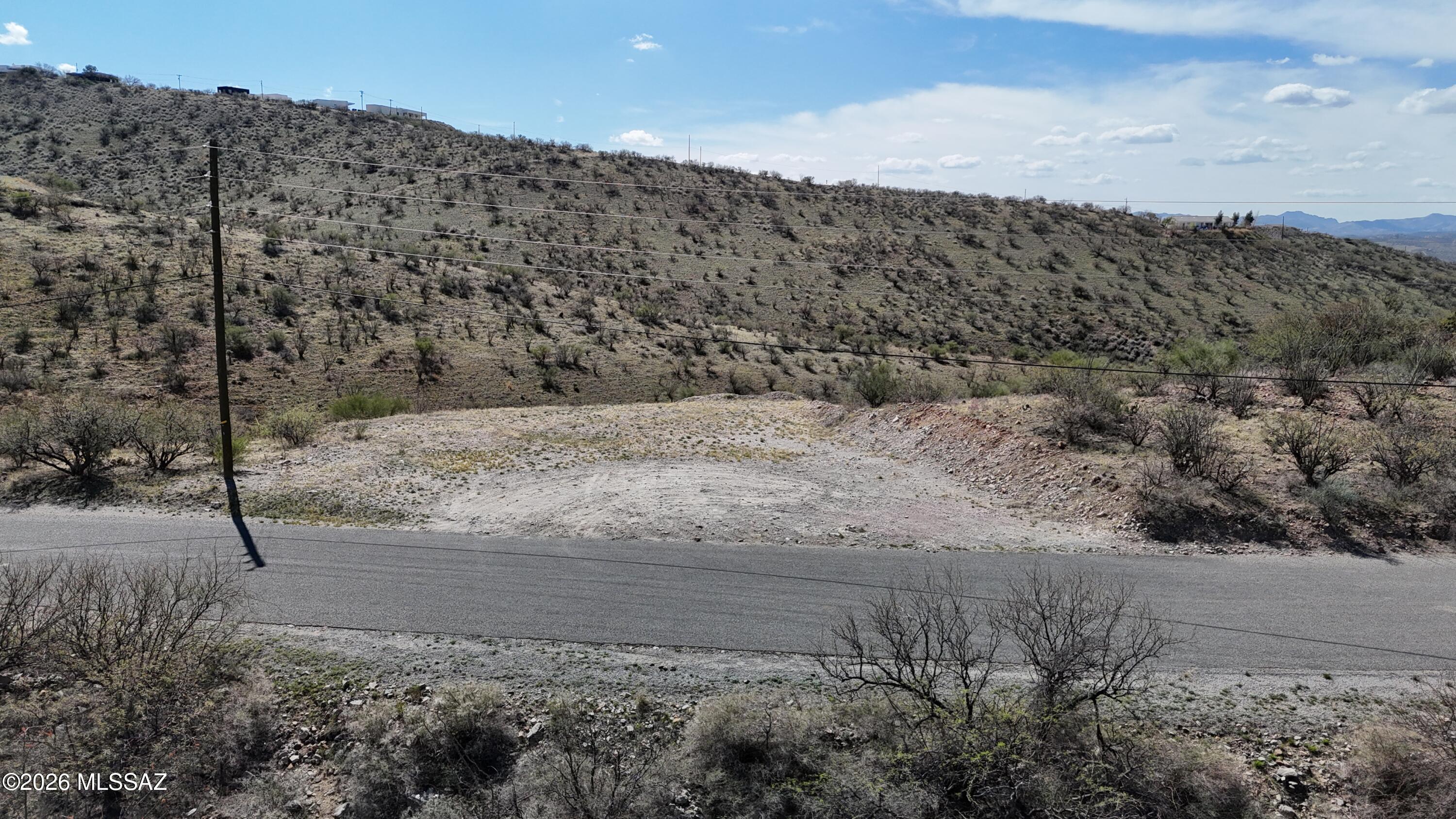 Residential lot with a high up location for great views.  Paved road, close to Palo Parado Rd and Highway entrance.