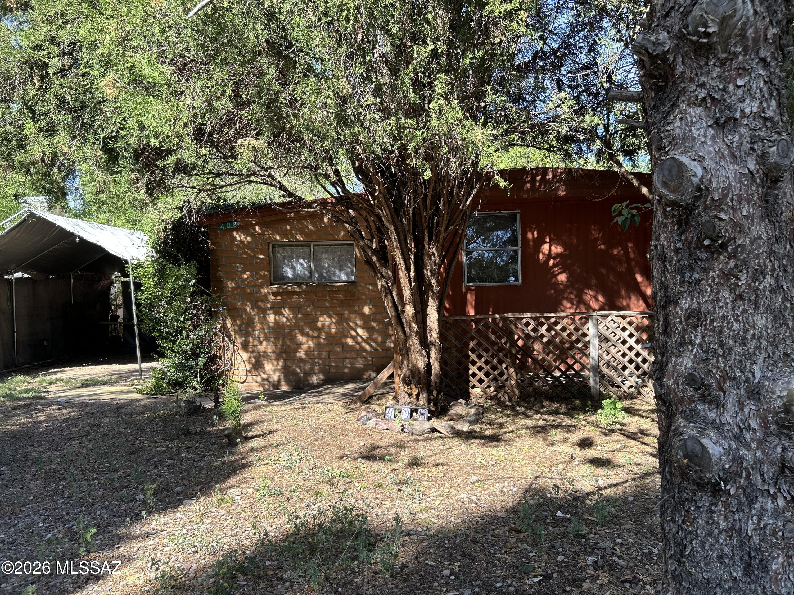 Great opportunity for an investor or an eager do-it-yourselfer!  Nice older affixed, single-wide mobile home with an added brick extension. Very livable in its current state, but would be even better with a little updating and tlc.  Most of the home still has its original amenities and equipment in working condition and is being sold furnished.  The mobile home itset is 720 sf excluding the added room.  The home is actually on 2 lots and goes all the way back to the creek.  There is room to add an RV or other improvements.  Excellent long-term or short term rental potential.