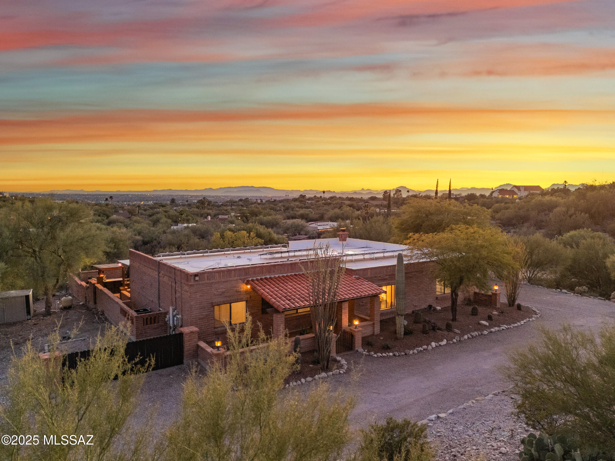 This stunningly updated Foothills home brings together luxury, function, and breathtaking scenery on a generous 1.9-acre lot. Framed by expansive Catalina Mountain silhouettes and sparkling city views, the property has been fully remodeled with meticulous attention to detail.
Enjoy solar power for lower utility costs, smartly concealed TV connections behind artwork, and a modern floor plan designed for effortless living and entertaining. Outside, the usable acreage includes a  horse corral, offering rare flexibility for equestrian needs or future expansion. Every space feels polished and intentional—delivering a refined blend of high design, outdoor lifestyle, and everyday comfort.