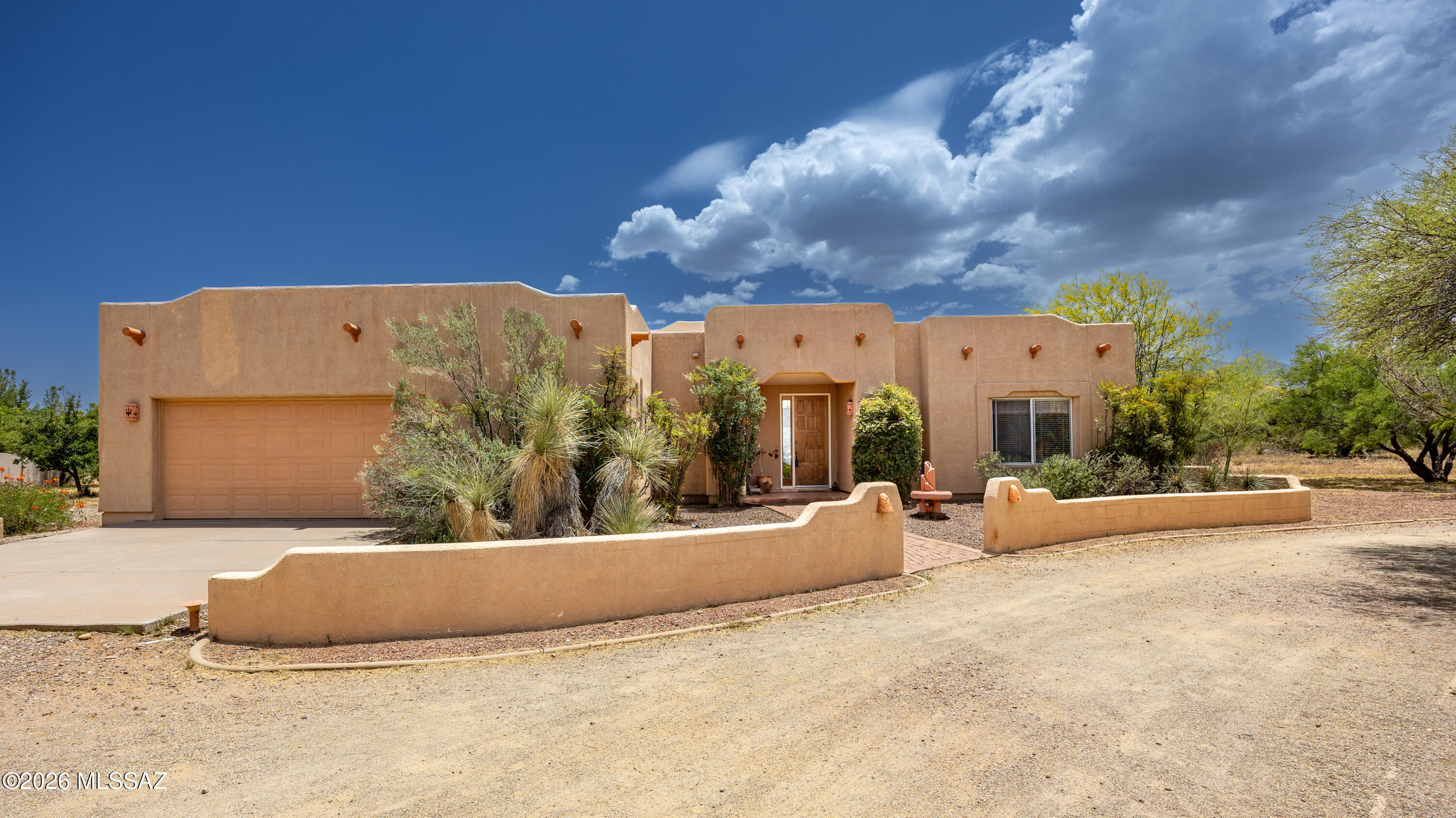 Lovely Santa Fe-style home in Mountain Shadows! Featuring 3 bedrooms, 2 bathrooms, and a 2.5-car garage filled with natural light. Kitchen offers abundant cabinets and counter space, eat-in area, and opens to the family room for easy living and entertaining. Primary suite features French doors into the room, bay window, and a private door to the back patio. Ensuite includes a walk-in closet and separate tub and shower. Guest bedrooms are split from the primary for privacy. Living room opens to a large, covered patio. Backyard is expansive, mostly enclosed with block wall and chain-link fencing, plus a separate fenced area for garden or dog run. New roof 6/2026. Home is ready for a new owner's vision and updates, and the price reflects the opportunity to make it truly your own.