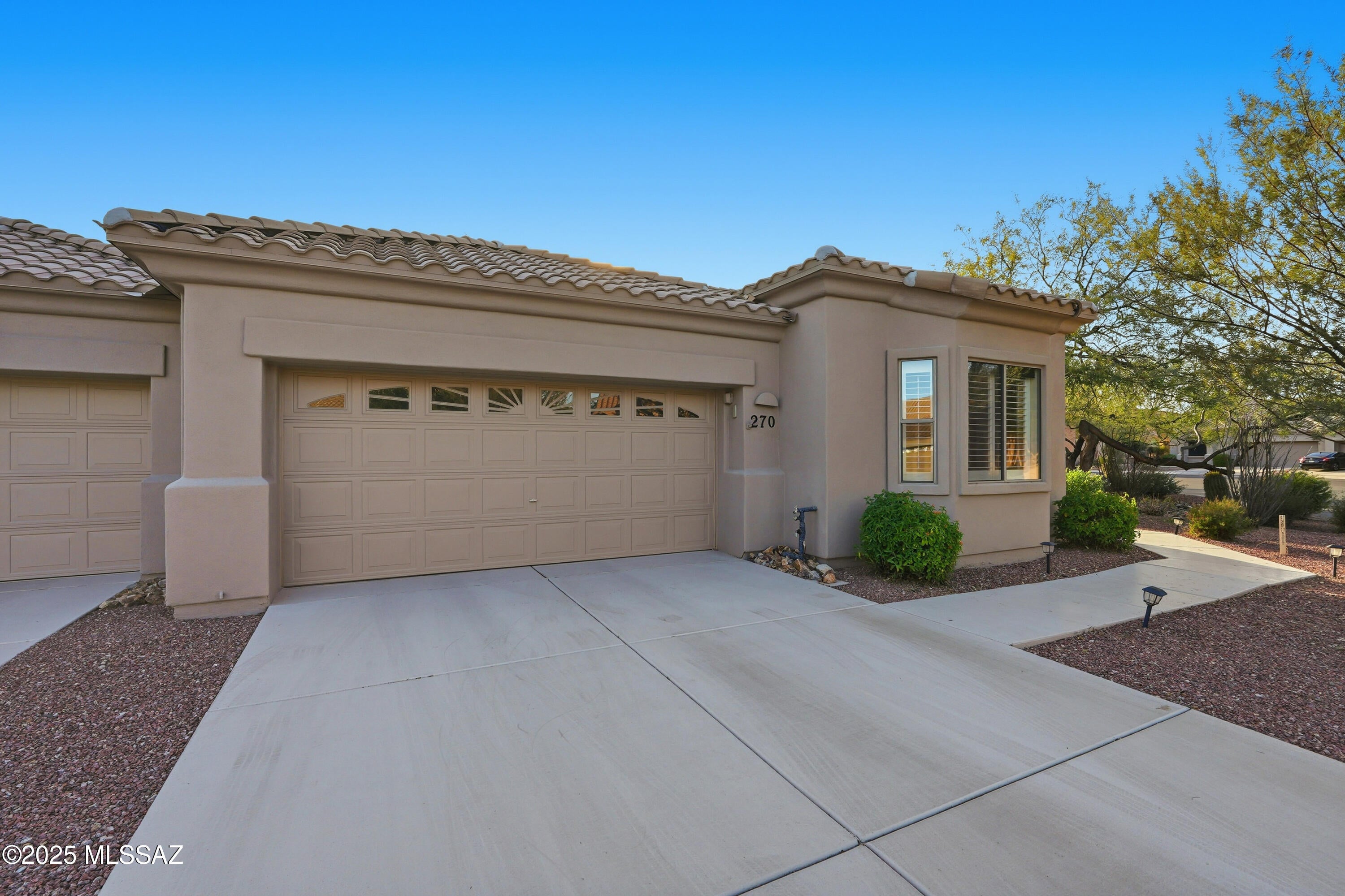 Southwest Kitchen & Bath did a beautiful job remodeling the kitchen & baths in this lovely townhome, in a gated sought after 55 plus community in beautiful Oro Valley, AZ. The spacious kitchen w granite countertops, pull out drawers for easy use, newer stainless refrigerator & updated cabinets make this kitchen a nice place to cook a meal. A small room off the kitchen is where the pantry, desk, & microwave are located. A very convenient space! Gorgeous granite in both bathrooms, w/the primary bath boosting a custom walk-in shower, double vanities & a walk-in closet. Tile & luxury vinyl flooring, no carpet. 1593 sq. ft. 2 bedrooms/2 baths & a den. Large windows w/beautiful shutters bring in natural light & showcase the backyard open space. 
Furniture available on separate bill of sale.