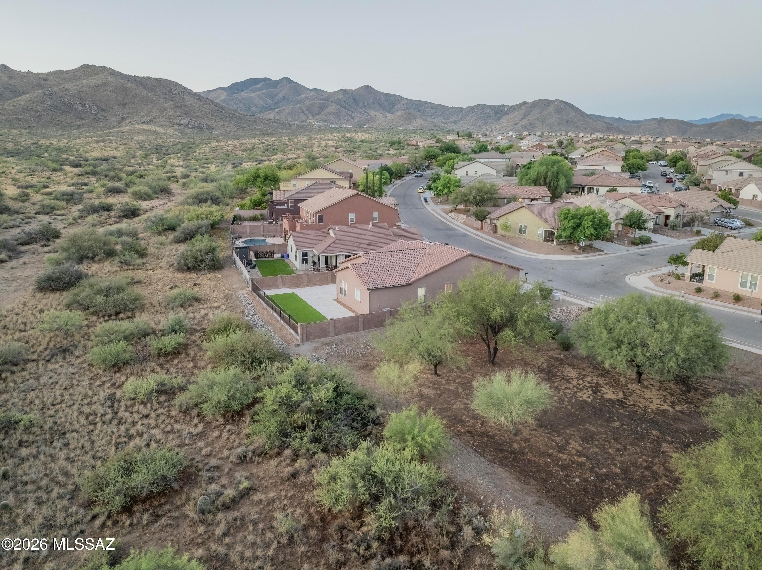 Premium Lot. Endless Views. Absolute Perfection! This home is perfectly positioned on a premium homesite offers the ideal blend of comfort, style, and Arizona living. Backing to state land with breathtaking mountain and desert views, this private sanctuary enjoys only one neighboring home, creating a rare sense of space and tranquility. From the
moment you arrive, you'll appreciate the home's outstanding curb appeal, highlighted by attractive stone accents, a welcoming front porch, and fresh interior and exterior paint. Lovingly maintained and move-in ready, this 3-bedroom, 2-bath home with a 2-car garage is loaded with thoughtful upgrades, including a newer roof, custom shutters, upgraded lighting and ceiling fans. Inside, the open-concept floor plan is enhanced by soaring 10-foot ceilin ceilings, creating a bright and spacious atmosphere. The well-appointed kitchen features rich 42-inch cherry cabinetry, Corian countertops, a breakfast bar, abundant storage, Stainless steel appliances, and a gas range, making it both functional
and inviting. The expansive primary suite offers a relaxing retreat with a walk-in closet, dual vanities, and a soaking tub and shower combination, while the secondary bath is equally well-appointed with raised cherry cabinetry and quality finishes. Move outside to
a backyard designed for year-round enjoyment. The beautifully finished outdoor space features travertine tile and artificial turf, making it perfect for entertaining or enjoying
Arizona's spectacular sunsets. The low-maintenance landscaping provides beauty without the upkeep, while the open views and direct state land backdrop create an unmatched sense of privacy. Located within the highly acclaimed Vail School District,
this pristine home truly offers the complete package--upgrades, views, privacy, and an unbeatable location. This is the one you've been waiting for.