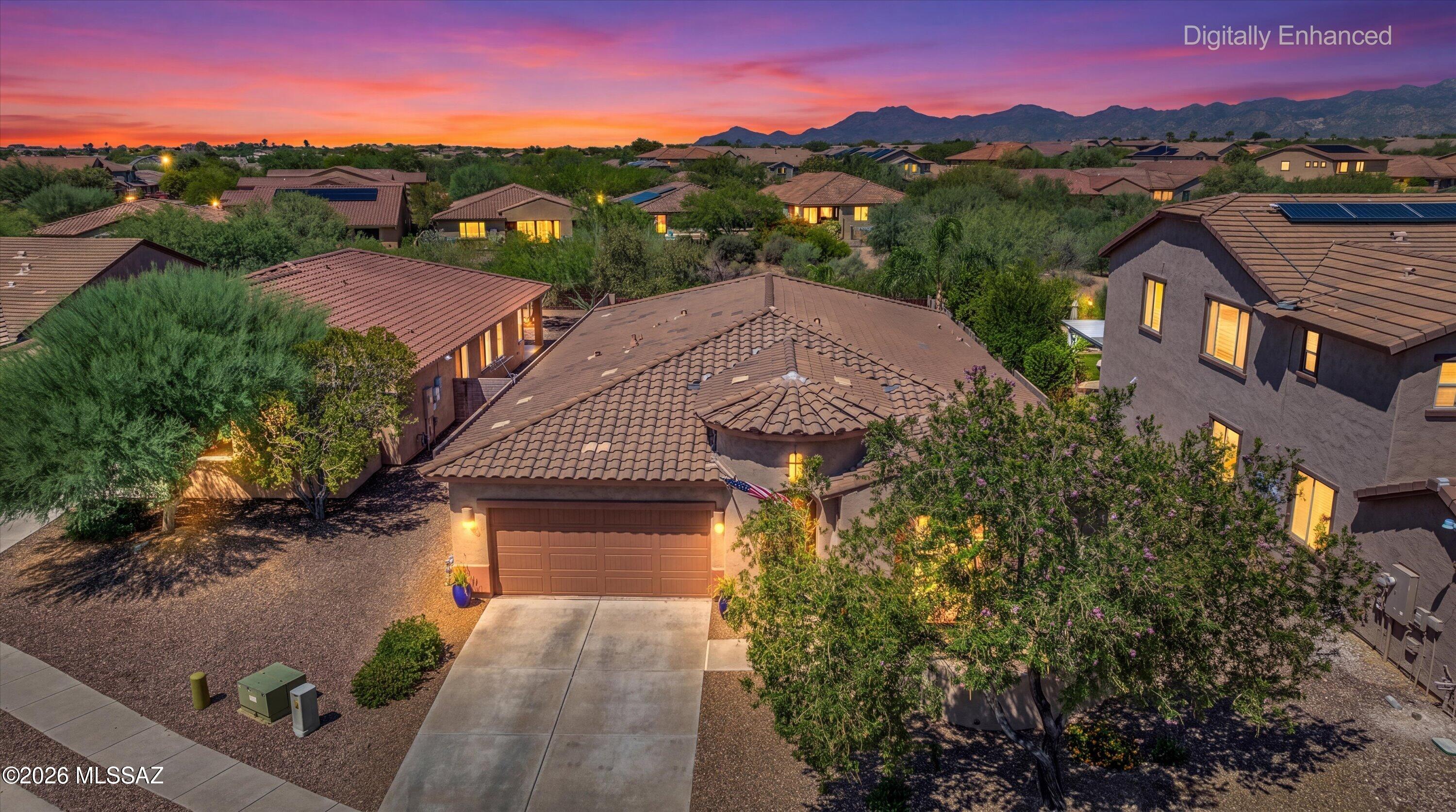 Gated Hohokam Mesa retreat with sweeping Santa Catalina Mountain views and a backyard designed for Arizona living. This single-level home offers 3 bedrooms, a den, dedicated office nook, 2 full baths, and a 3-car tandem garage, combining a flexible floor plan with beautiful indoor-outdoor living.

At the heart of the home, the open-concept great room flows seamlessly into a spacious kitchen featuring richly toned cabinetry, granite countertops, an oversized center island with seating, decorative tile backsplash, stainless steel appliances, built-in double ovens, gas cooktop, and generous storage. A dedicated den and separate built-in office nook provide flexible spaces for working from home, a media room, playroom, or additional sitting area.
The primary suite is privately positioned and features an ensuite bath with dual vanities, soaking tub, separate shower, and a spacious walk-in closet. Secondary bedrooms are located on the opposite side of the home and are served by a full guest bath with a double vanity, creating privacy and separation for guests or family.
Step outside and the backyard becomes the centerpiece. The resort-style setting features a pebble-finish pool, raised spa with cascading water feature, built-in fire pit, expansive paver patio, and artificial turf, all framed by beautiful Santa Catalina Mountain views. Multiple outdoor gathering areas provide plenty of room for dining, lounging, entertaining, and enjoying Oro Valley sunsets.
Additional highlights include built-in surround sound in the living room, ceiling speakers in the covered patio, primary bedroom, and den, an oversized laundry room with extensive cabinetry and storage, a 3-car tandem garage, and low-maintenance desert landscaping.
Set within the gated Hohokam Mesa enclave of Rancho Vistoso, the home is ideally positioned to enjoy the best of Oro Valley, with championship golf, extensive trail systems, shopping, dining, and year-round outdoor recreation all nearby. From the Santa Catalina Mountain views to the resort-style backyard and thoughtfully designed floor plan, this is a home made for the Southern Arizona lifestyle.
Contact Oliver Realty today to schedule your private showing.