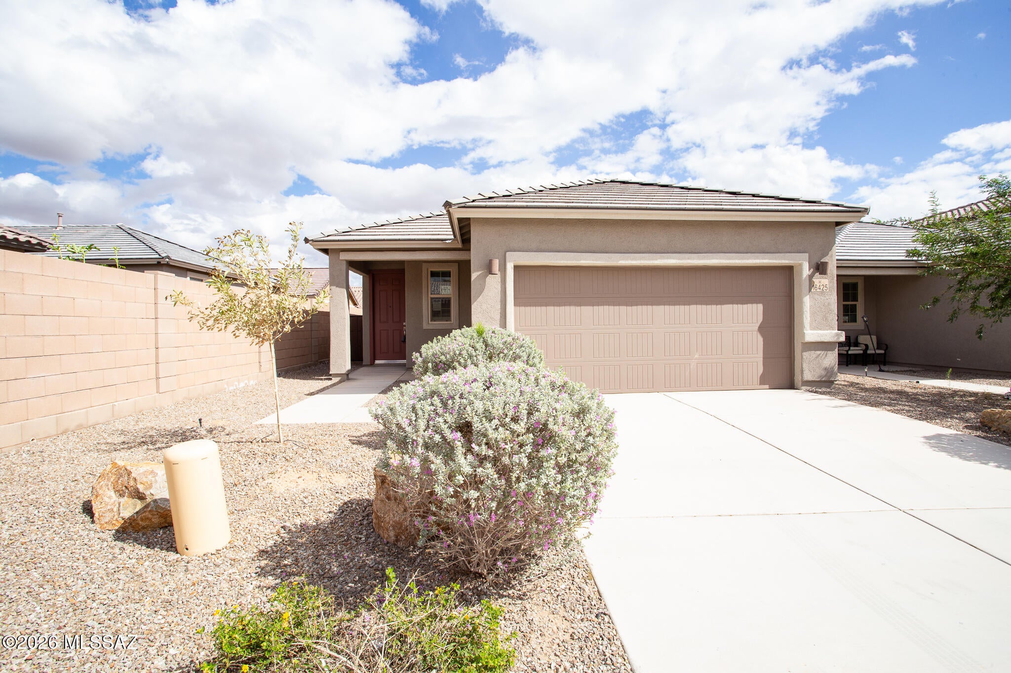 Beautiful home built in 2023 and located in the popular community of Rancho Sahuarita with community pools, splash pad, clubhouse, exercise facilities, parks, basketball courts, trails & much more! This contemporary home is next to park with basketball court and features 3 bedrooms and 2 bathrooms with a thoughtfully designed interior with modern finishes and efficient layout. The kitchen is equipped with stainless steel appliances, elegant quartz counter tops, breakfast bar & dining area. Primary bathroom with dual sinks & walk-in shower.  Spacious laundry room, backyard with covered patio & mountain views great for entertaining. Enjoy all the benefits Rancho Sahuarita has to offer! Call Agent for more details. This is a Fannie Mae HomePath property. First Time Buyers, complete the HomePath Ready Buyer homeownership course on Homepath.com. Attach certificate to offer up to 3 percent closing cost assistance. Check HomePath.com for more details. Restrictions apply.