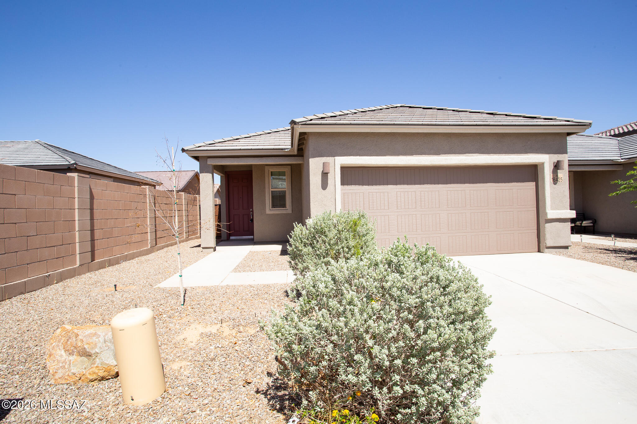 Beautiful home located in the popular community of Rancho Sahuarita with community pools, splash pad, clubhouse, exercise facilities, parks, basketball courts, trails & much more! This contemporary home features 3 bedrooms and 2 bathrooms with a thoughtfully designed interior with modern finishes and efficient layout. The kitchen is equipped with stainless steel appliances, elegant quartz counter tops, breakfast bar & dining area. Primary bathroom with dual sinks & walk-in shower.  Spacious laundry room & backyard with covered patio & mountain views great for entertaining. Enjoy all the benefits Rancho Sahuarita has to offer! Schedule your showing today to explore this well designed contemporary residence. This is a Fannie Mae HomePath property. First Time Buyers, complete the HomePath Ready Buyer homeownership course on Homepath.com. Attach certificate to offer up to 3 percent closing cost assistance. Check HomePath.com for more details. Restrictions apply.