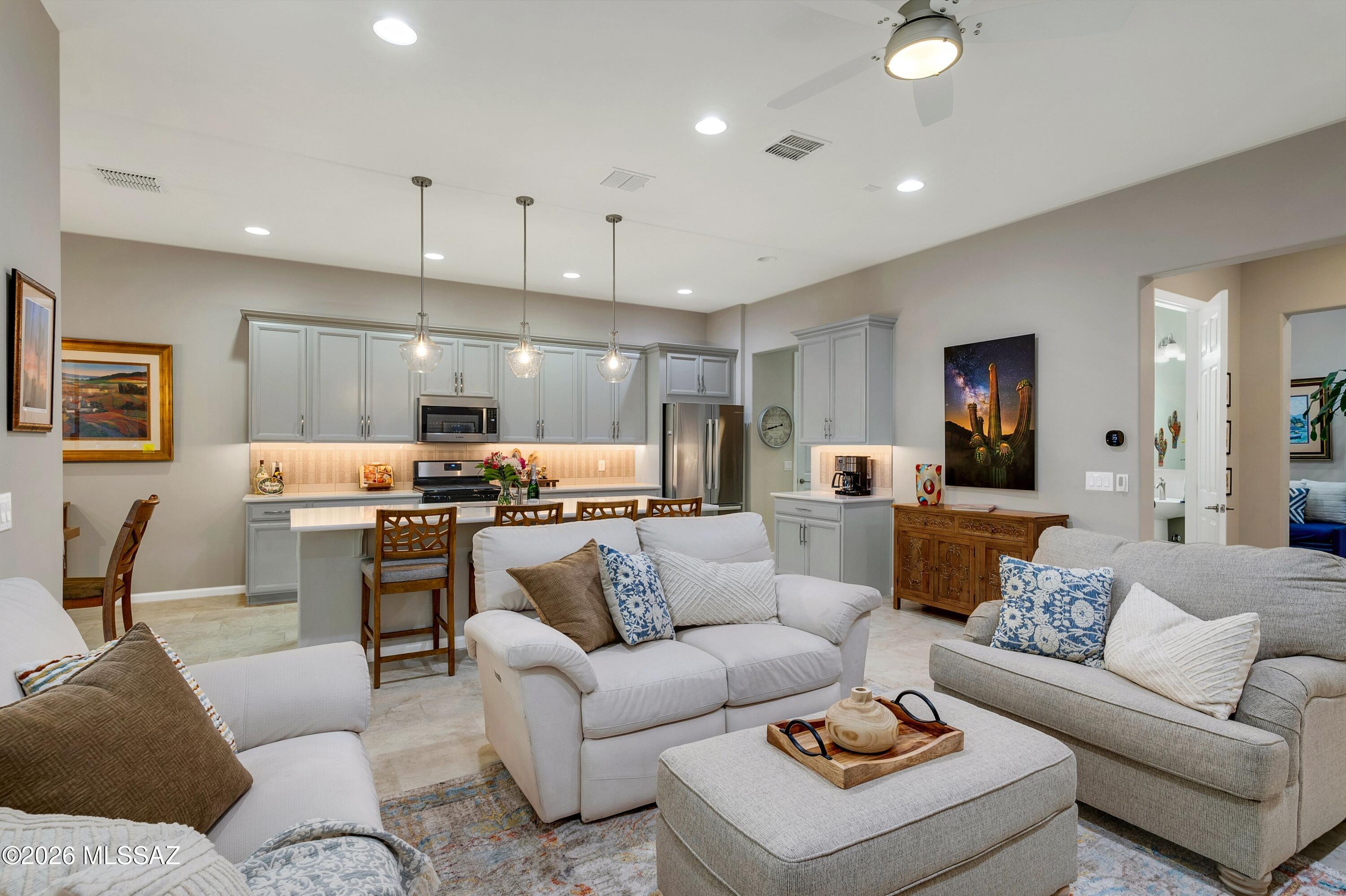Welcome to Ridgeview in Rancho Vistoso an exclusive, highly sought-after gated community nestled in one of Oro Valley's most desirable neighborhoods.
This pristine, move-in-ready patio home showcases an open, thoughtfully designed floor plan ideal for both everyday living and effortless entertaining. The spacious island kitchen, complete with breakfast bar and dining nook, flows seamlessly into the great room, creating a warm and inviting atmosphere.
The primary suite serves as a private retreat, while the den/ office offers flexible space for remote work or additional living needs.
A standout feature of this home is the private detached casita  w/ courtyard perfect for guests or multigenerational living featuring a built-in sink and mini-fridge, full bathroom.