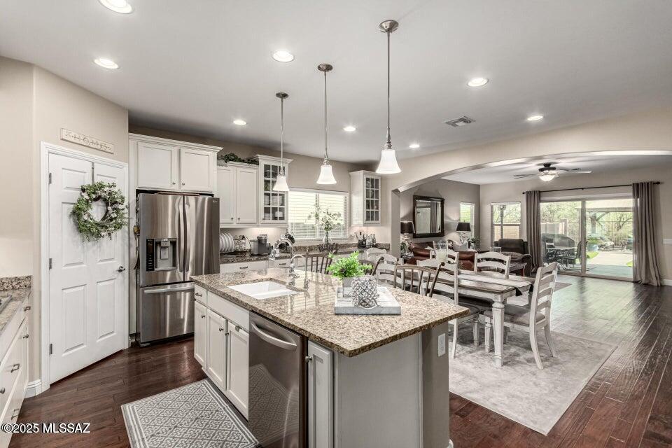 Range price- Seller will accept or counter offers between $450K-$475K.
Experience the epitome of luxurious living in the highly coveted Sierra Morado community! This exquisite, light-filled residence boasts an open floor plan, nestled amidst the breathtaking Rincon mountains in a tranquil, serene neighborhood on a cul-de-sac. The 3-bedroom single story home, complemented by a separate office with French doors, 2 bathrooms, and a 3-car extended garage, showcases numerous upgrades. The gourmet kitchen features granite countertops, white cabinets with pull-out drawers, ample storage and countertop space, a reverse osmosis system, under-cabinet lighting, a spacious island with a breakfast bar, stainless steel appliances and a gas stovetop.
Engineered wood flooring throughout, built-in entertainment center as a focal point in the great room.
The expansive backyard offers a private setting ideal for outdoor entertainment. Additional features include a side door in the tandem garage with an extended 4 feet added, epoxy floors, and added shelving for storage. Located within the award-winning Vail school district, this property is conveniently situated near a park with slides, community pool, BB court, hiking trails, Raytheon, IBM, Davis Monthan Air Force Base, golf courses.
A newly constructed hospital is located just minutes away.