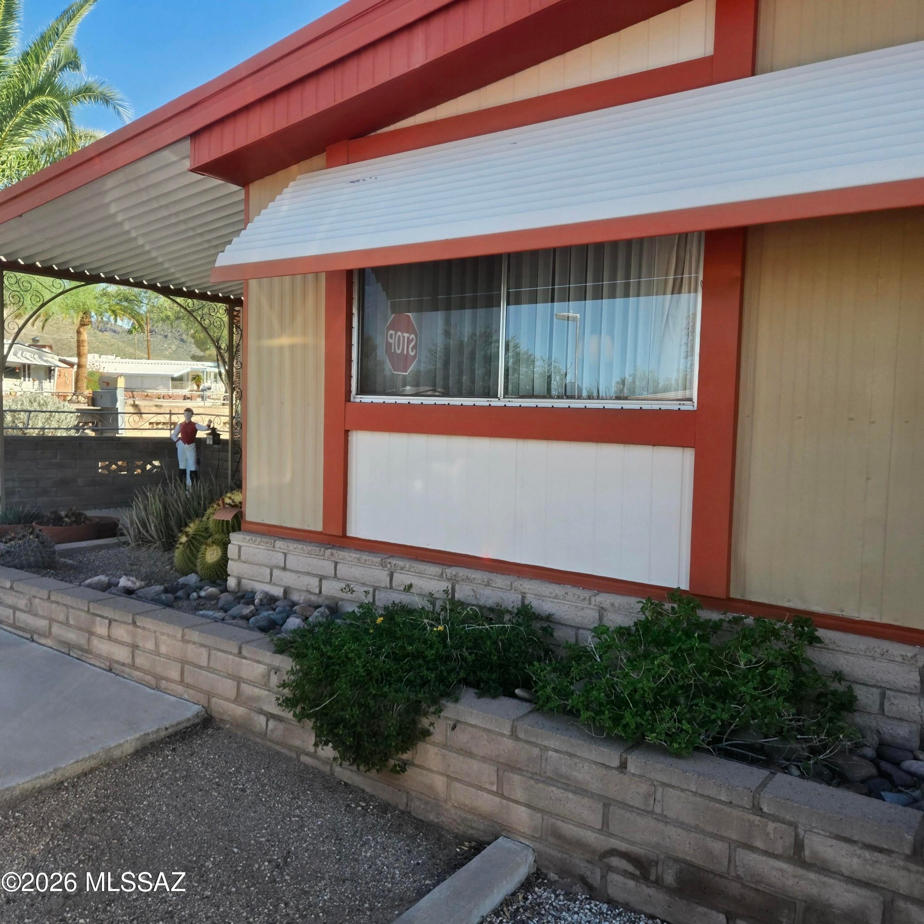 Discover the possibilities at 2633 S Western Way Circle! Situated on a large corner lot near community amenities, this home offers a spacious kitchen, two living areas, an Arizona room, and large front windows that fill the home with natural light. Enjoy outdoor living with a covered patio, fenced side and backyard areas, fruit tree, large workshop, and additional parking. A new HVAC system installed in 2026 adds peace of mind. Tucson Estates residents enjoy an 18-hole executive golf course, two pools, spa, hot tub, fitness center, library, recreation hall, Circle Park, radio station, and countless activities. Minutes from hiking and biking trails, Gates Pass, Old Tucson, the Desert Museum, and just 20 minutes to downtown Tucson and the U of A. You own the land!!