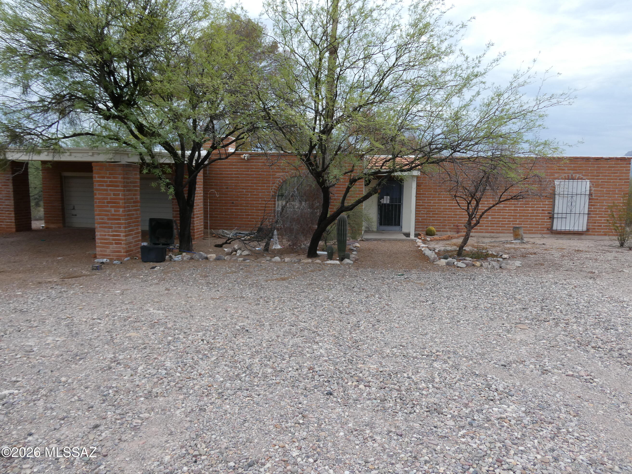 Ranch style adobe home on almost 2 acre lot with views, has a 2-car garage and 2-car carport, central ac, fenced back yard, fireplace.  Home needs updating has popcorn ceiling, dated kitchen, carpet is stained.  Has newer hot water heater.  Being sold AS IS.