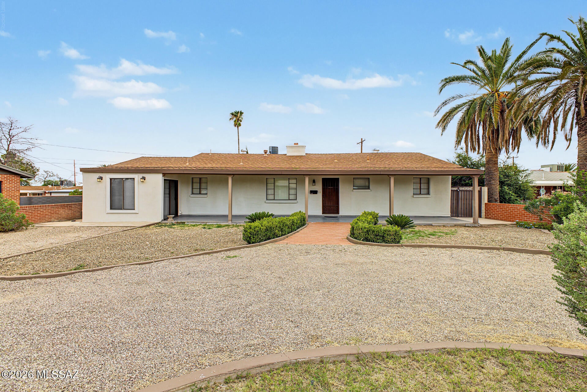 NO HOA, RV PARKING & AN ATTACHED GUEST SUITE! This versatile central Tucson home offers the space, flexibility, and features that are hard to find. A circular driveway and expansive front yard provide plenty of room for parking, including RV parking with convenient proximity to the plumbing cleanout.

Inside, comfortable living spaces are highlighted by a cozy fireplace, while the well-appointed kitchen features granite countertops, a full backsplash, and ample cabinetry. The primary suite offers a private escape with its own Arizona room, creating the perfect spot for a cozy sitting area or a peaceful place to unwind surrounded by your favorite plants.

A HUGE BONUS is the attached 1-bedroom guest suite, complete with its own living room and en-suite bath! This flexible space is ideal multigenerational living, a private home office, second primary suite, or House Hacking for additional income!

Outside, enjoy a spacious patio, well-laid pavers, alley access, a storage shed, and tons of additional storage throughout the property. Ideally located in central Tucson with convenient access to dining, shopping, downtown, and everyday amenities. With NO HOA, flexible living spaces, generous parking, and so many possibilities, this home is a rare find!