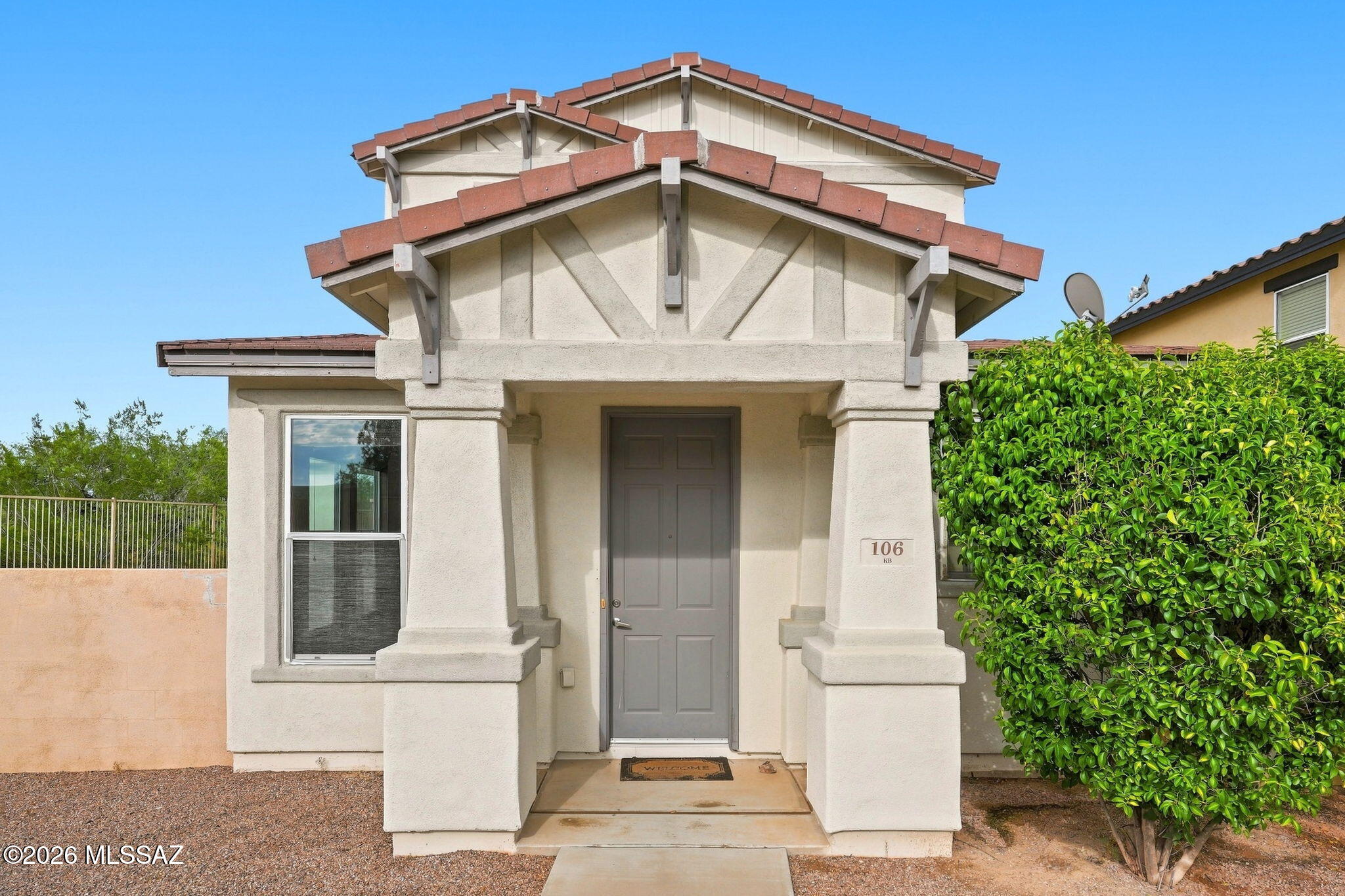 Very cute 3-bed, 2.5-bath home in the award-winning Rancho Sahuarita Community! Situated adjacent to a quiet wash, this home offers premium privacy and beautiful mountain views. The open living space features built-in surround sound speakers and beautifully updated flooring. A premium kitchen boasts tall cabinets, crown molding, a double wall oven, and a gas cooktop. The primary suite includes dual sinks and two large closets. The backyard features an extended concrete and turf patio with wrought iron and block  fencing. Enjoy Rancho Sahuarita amenities including community pools, splash parks, shopping, walking trails and a lake!