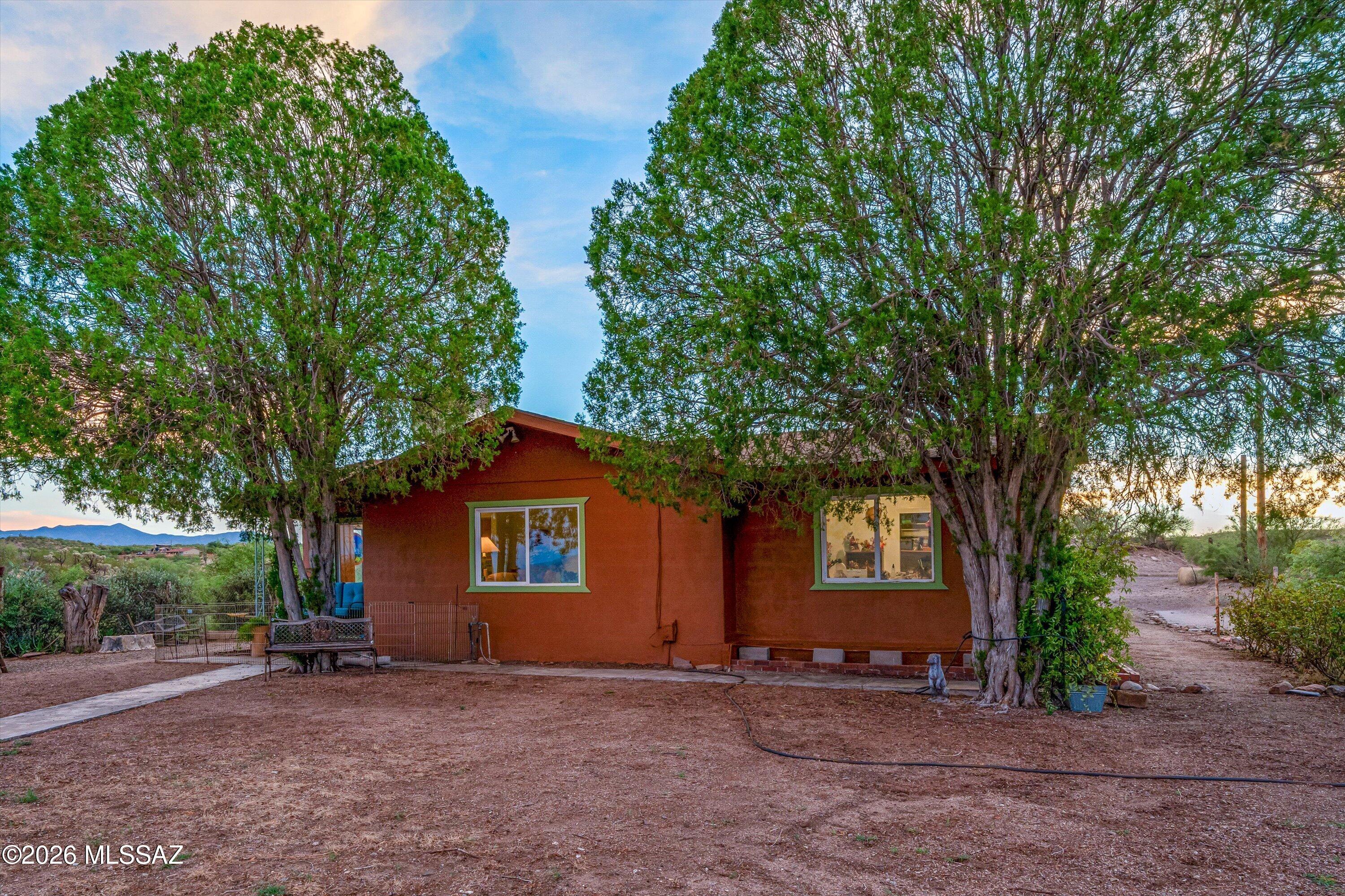 Motivated Seller! Private Galiuro Mountain & San Pedro Valley Retreat on 3.18 acres, offering stunning mountain VIEWS!!!!This one-of-a-kind property borders AZ State Land and provides direct access to the San Pedro River.This cozy 3-bedroom, 1-bath home features a spacious living room, AC, a private well, and a carport with an attached workshop.The roof was brand new as of July 2026, the kitchen has new appliances, and the laundry room has a new washer & dryer. A bonus room with heating and AC provides plenty of possibilities. Outside, is a true desert oasis, with mature trees, native desert vegetation, and a greenhouse. There is plenty of room for your toys and horses. The property also features an old-fashioned corral and barn that needs lots of TLC. This unique property is a rare find!