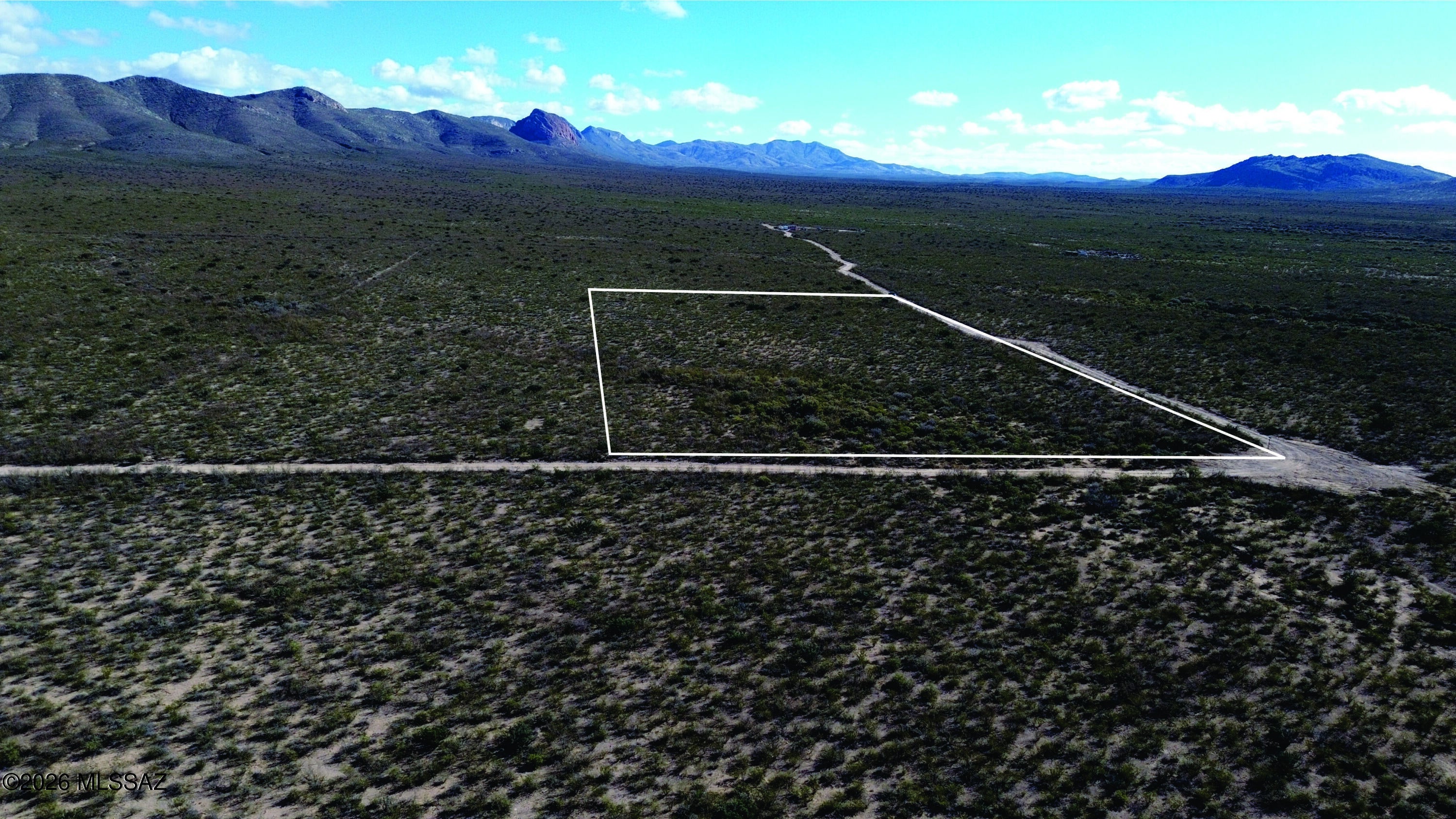 This is a vacant 4.29-acre parcel in the Valley Springs 06 subdivision. It offers a quiet corner of southeastern Arizona's high-desert landscape, ideal for those seeking a personal retreat or a base for outdoor adventure. The property sits near Douglas, a historic border town, with the Mule Mountains to the west and the more distant Chiricahua Mountains offering a dramatic backdrop for enjoying the region's unique ecosystem and expansive views. Short drive to all of Cochise counties historic sites. Seller financing is available with $2900 Down plus Pioneer Title account setup and closing Costs, for 3 years at 9.9 percent interest. with a payment of $257.76 per month plus Pioneer Title Processing fee and impounded property tax