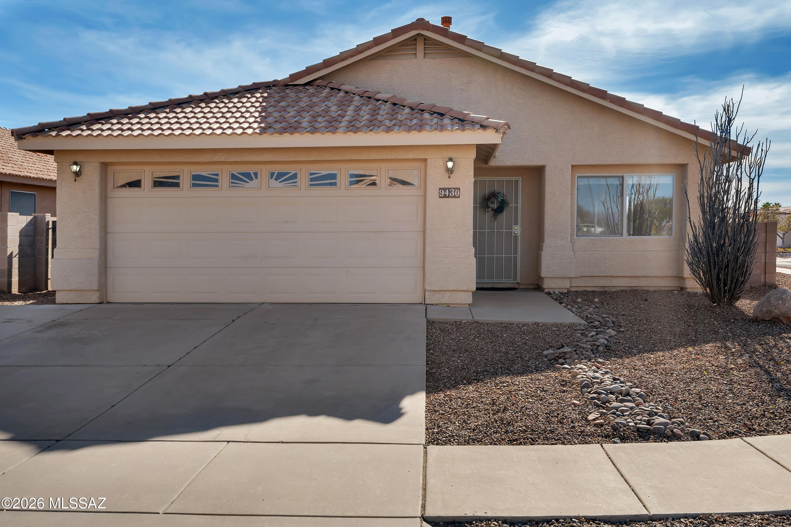 Great corner lot with loads of upgrades in desirable Rita Ranch neighborhood with no HOA. Popular floor plan features bright kitchen with breakfast bar that opens into large family room. Separate Living room. Spacious owners suite with walk-in closet and dual vanity. New HVAC installed 2023. New carpet in bedrooms. Exterior wood freshly painted. Covered patio with charming tile floor. Professionally landscaped back yard has 12x12 matching workshop/storage with tile roof and wide entry.