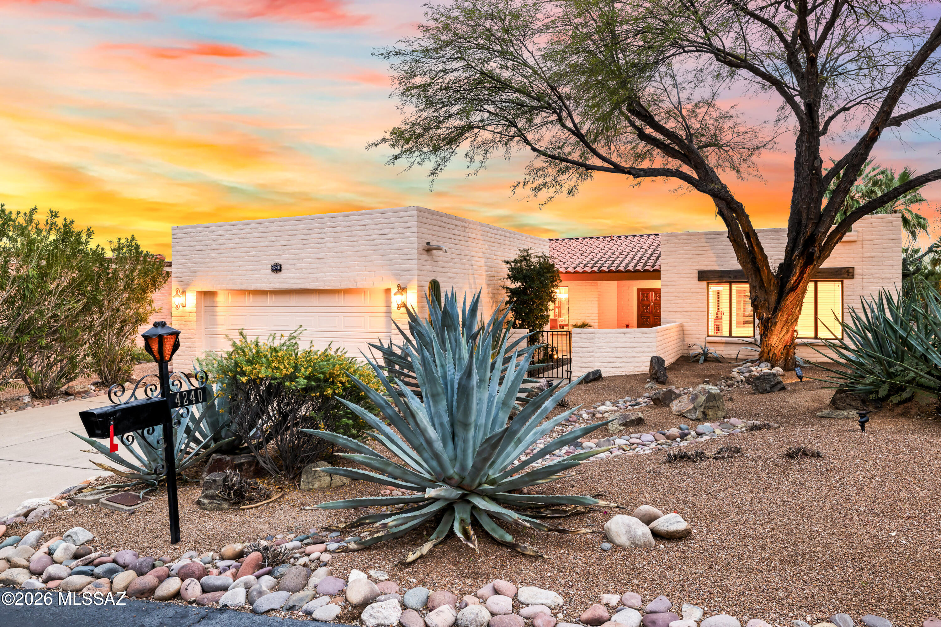 Nestled in a sought-after Gated community in the prestigious Catalina Foothills, this beautifully updated 3-bedroom, 3-bath residence blends timeless Southwestern charm with refined modern upgrades -- all in an unbeatable location, close to premier shopping, dining, art galleries, golf, and hiking. A charming courtyard entry welcomes you into a warm and inviting interior featuring natural stone flooring throughout  the living areas with no interior steps! The remodeled eat-in kitchen is a showstopper, showcasing dramatic granite countertops and professional-grade Viking appliances, perfect for both everyday living and entertaining. The living room exudes character with its classic beehive fireplace, built-in shelving adorned with antique wood doors, and an impressive oversized slide-and- stack patio door that seamlessly connects indoor and outdoor living spaces. The generously sized primary suite offers stylish wood-look tile flooring, and a gorgeous remodeled spa-inspired bath with stunning tile shower, custom cabinets, and his and hers closets. A spacious guest room with its own ensuite bathroom captures mountain views, while the third bedroom, currently staged as a home office, provides direct patio access for flexible living. Step outside to your private backyard retreat featuring a tranquil fountain, multiple seating areas, and a covered patio adorned with festive string lights-ideal for evening cocktails and al fresco dining against sparkling city light views. Additional upgrades include: New interior paint throughout, new carpet in the guest bedrooms, updated light fixtures, and high quality Milgard doors and windows throughout. A 2 car garage with workshop/storage area and fresh epoxy floor completes this special property. Whether you're looking for a luxury lock-and-leave vacation home or a full time residence, this exceptional home offers comfort, character, and captivating views, all within one of Tucson's most desirable communities, within walking distance to Catalina Foothills High School.
