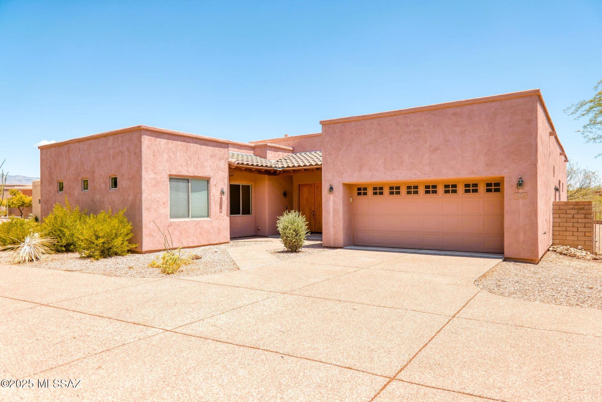 This beautiful home offers elegance and functionality throughout, providing an ideal setting for comfortable desert living.  A stunning double door welcomes you inside.
The open living room features high ceilings, an integrated entertainment center, a cozy gas fireplace, an ample ceiling fan, and a granite bar area at the kitchen pass-through.  A full wall sliding door leads to the backyard patio, perfect for entertaining.
The spacious kitchen features a cook's layout with ample granite countertops, including a large center island, 42'' upper maple cabinets, a pantry, a double oven, a breakfast nook with a built-in desk area, a whole-house intercom and radio system, additional cabinets, and a sliding glass door to the flagstone patio with a built-in gas grill-so convenient.
The split la offers a private master suite, which includes a sliding glass door to the backyard patio, a full bath with a shower, tub with glass block window, a double vanity, and an exceptionally large closet with built-in shelves.
This home offers easy access to the expansive backyard.  This area features a custom, flagstone patio with a built-in gas grill, a hightop table, a gas firepit with flagstone seating, walkways, and a wall planter, all surrounded by low-maintenance desert landscaping, views of Del lago Golf Course Hole #2, and the privacy of a larger, corner lot.
The casita is perfect for guests and multi-generational families.  It has a separate entrance, maple cabinets with a granite countertop, a wet bar with a mini-refrigerator, a 3/4 bath, and a separate mini-split for heating/cooling.
All the bedrooms have carpeting and ceiling fans.  All the common areas and bathrooms have ceramic tile.  All appliances and window coverings stay.
This home is move-in ready and priced to sell.