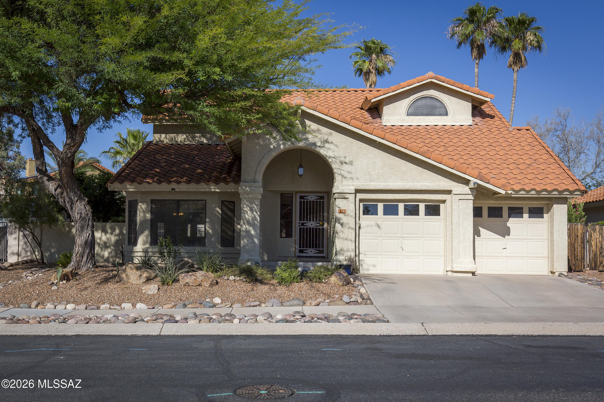 Comfortable Copper Creek home in the heart of Oro Valley with a private backyard and sparkling pool. Vaulted ceilings and abundant windows provide a bright, open feel throughout. Kitchen features granite countertops and a bay window overlooking the backyard. Family room with fireplace plus separate living and dining areas offer flexible space for everyday living and entertaining. Spacious primary suite includes multiple closets and a private deck with views of the yard and pool. Primary bath offers dual sinks, soaking tub and separate shower. Added storage throughout the home. Great Oro Valley location close to shopping, dining, parks and schools.
