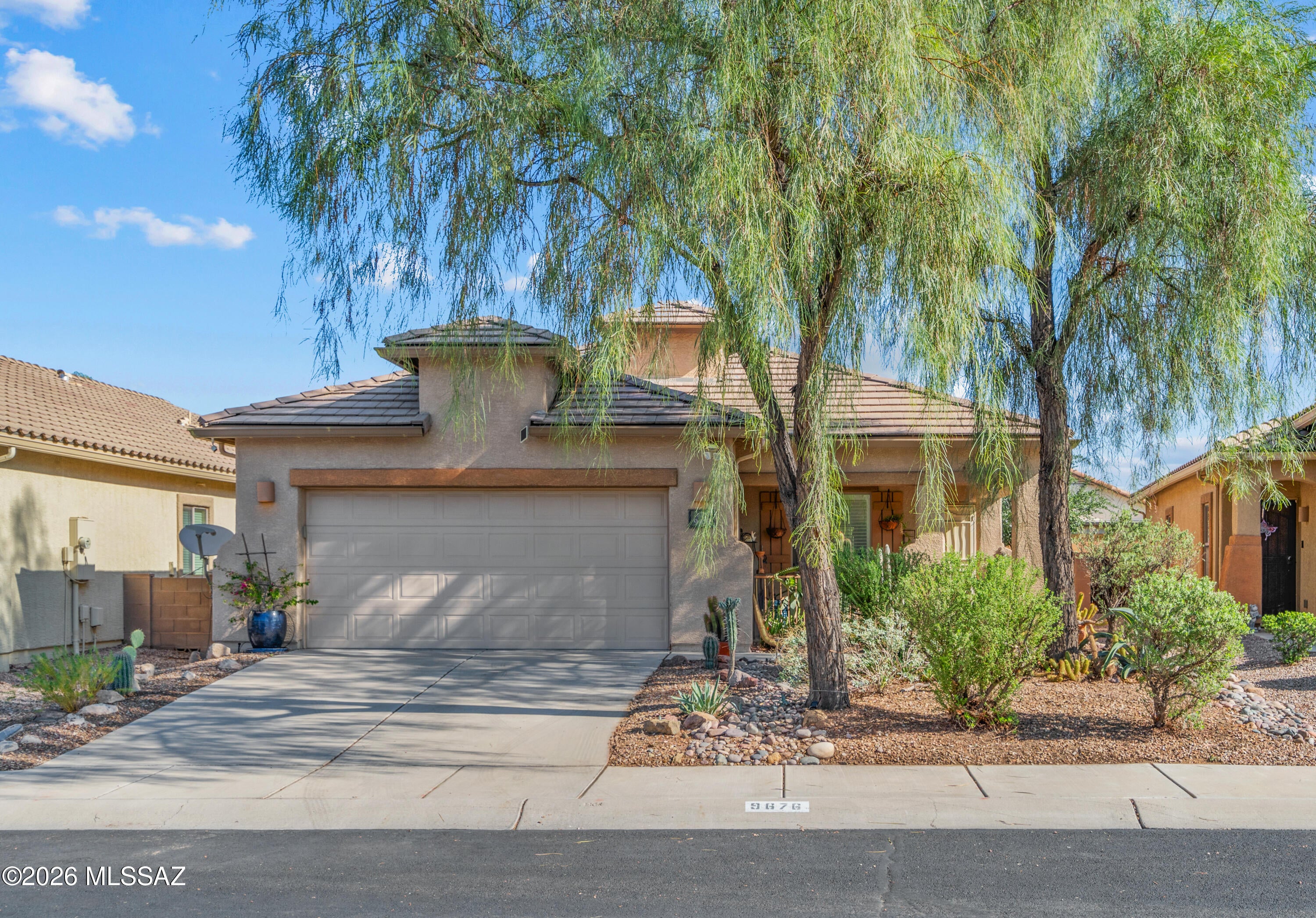Enjoy single-story living in Acacia Trails with 3 bedrooms, 2 baths, approximately 1,776 sq ft, a 2-car garage and owned solar with a 4 year old HVAC. The functional floor plan features a spacious living area, separate dining space, breakfast nook, dedicated laundry room, pantry and a generously sized primary bedroom with walk-in closet. Interior highlights include high ceilings, ceiling fans, plantation shutters, ceramic tile and carpet. Outside, enjoy low-care landscaping with decorative gravel, desert plantings, artificial turf, block fencing and a covered patio. Acacia Trails offers two community pools, a spa, sidewalks, paved streets, plus walking and biking paths. Convenient Northwest Tucson location near Twin Peaks Rd, Coachline Blvd and I-10. Hot tub, shed&potted plants dont convey