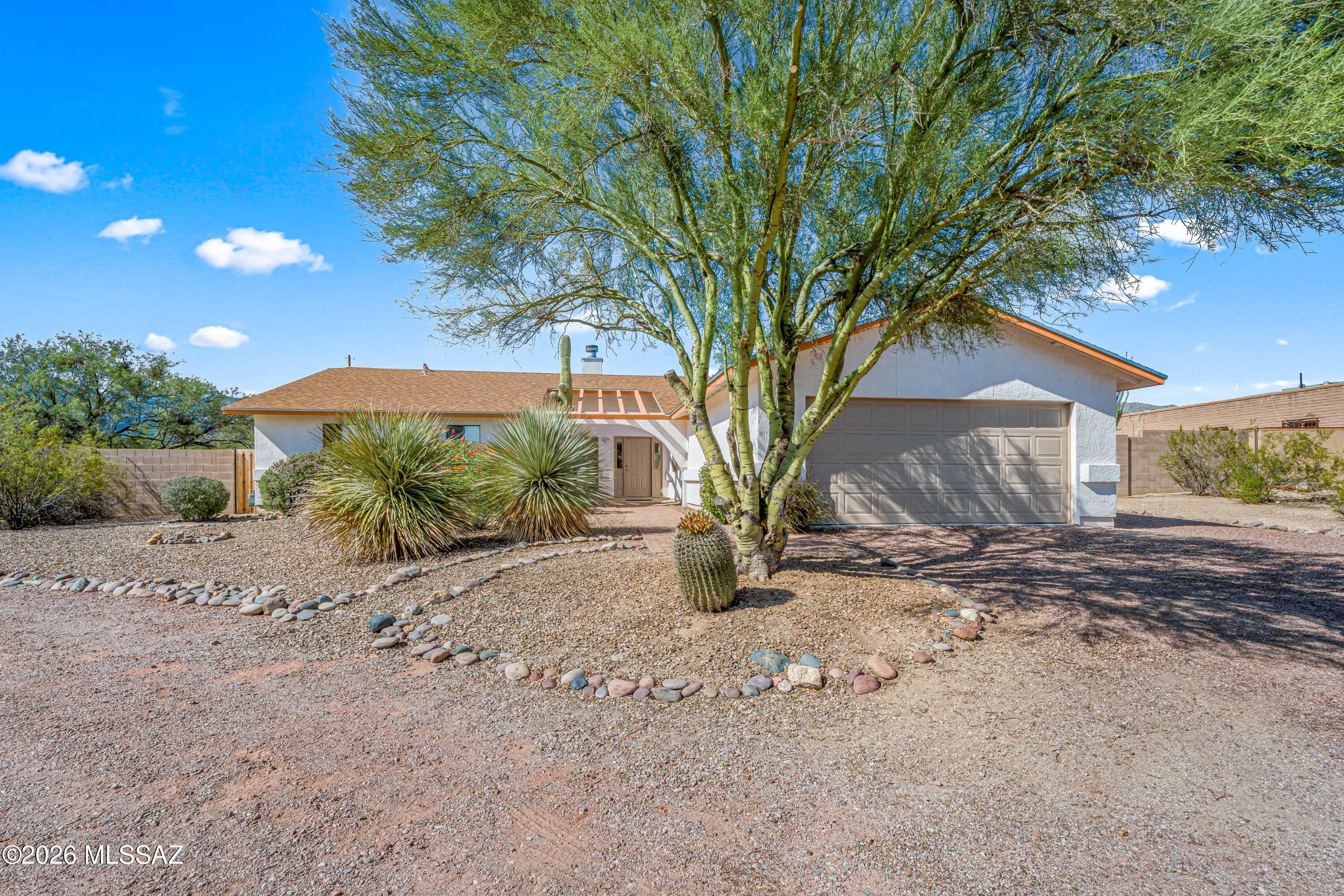 Beautifully maintained 3BD/2BA, 1,760 sq ft home on a .82 acre corner lot in NE Tucson. Features include cherry wood kitchen cabinetry with granite, vaulted ceilings, vinyl and tile flooring, and custom Tru Stile solid wood interior doors. Newer roof, HVAC system, water heater, and pool equipment. No polybutylene piping. Enjoy unobstructed Catalina Mountain views, full length covered porch, inground pool and jacuzzi, lush and mature desert landscaping, and a walled backyard. Property offers double gate access, detached shed, and ample space for RV/toy hauler/boat parking or future detached garage/guest unit. Quiet area near McDonald Park with easy access to Tanque Verde Valley amenities, hiking, biking, and Mt. Lemmon. Call it HOME today!