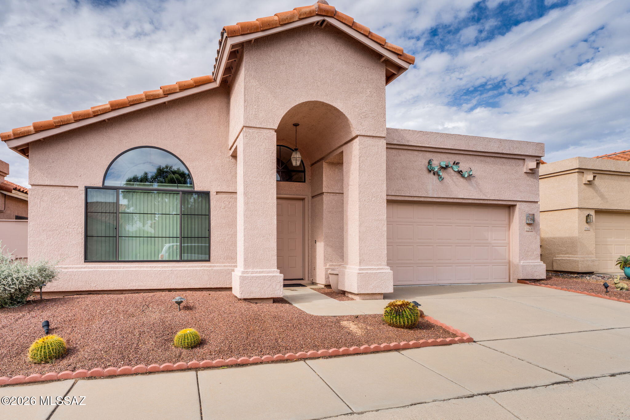 Seller will accept or counter offers 399,000 - 415,000.  Nestled in a quiet tucked away neighborhood with immediate access to the Riverwalk, this 3bd/2bth has been impeccably maintained by owner of more than 25 years.  Large open living spaces with vaulted ceilings.  Spacious kitchen with island, breakfast bar is open to dining area with fireplace.  Three spacious bedrooms.  Sliding doors lead to mature manicured backyard with covered patio and built in grill.  This home is completely turnkey, possibly sold fully furnished.  Move in ready.  Perfect for winter visitors or use as air bnb, vrbo. Ready to go!! Great opportunity.....