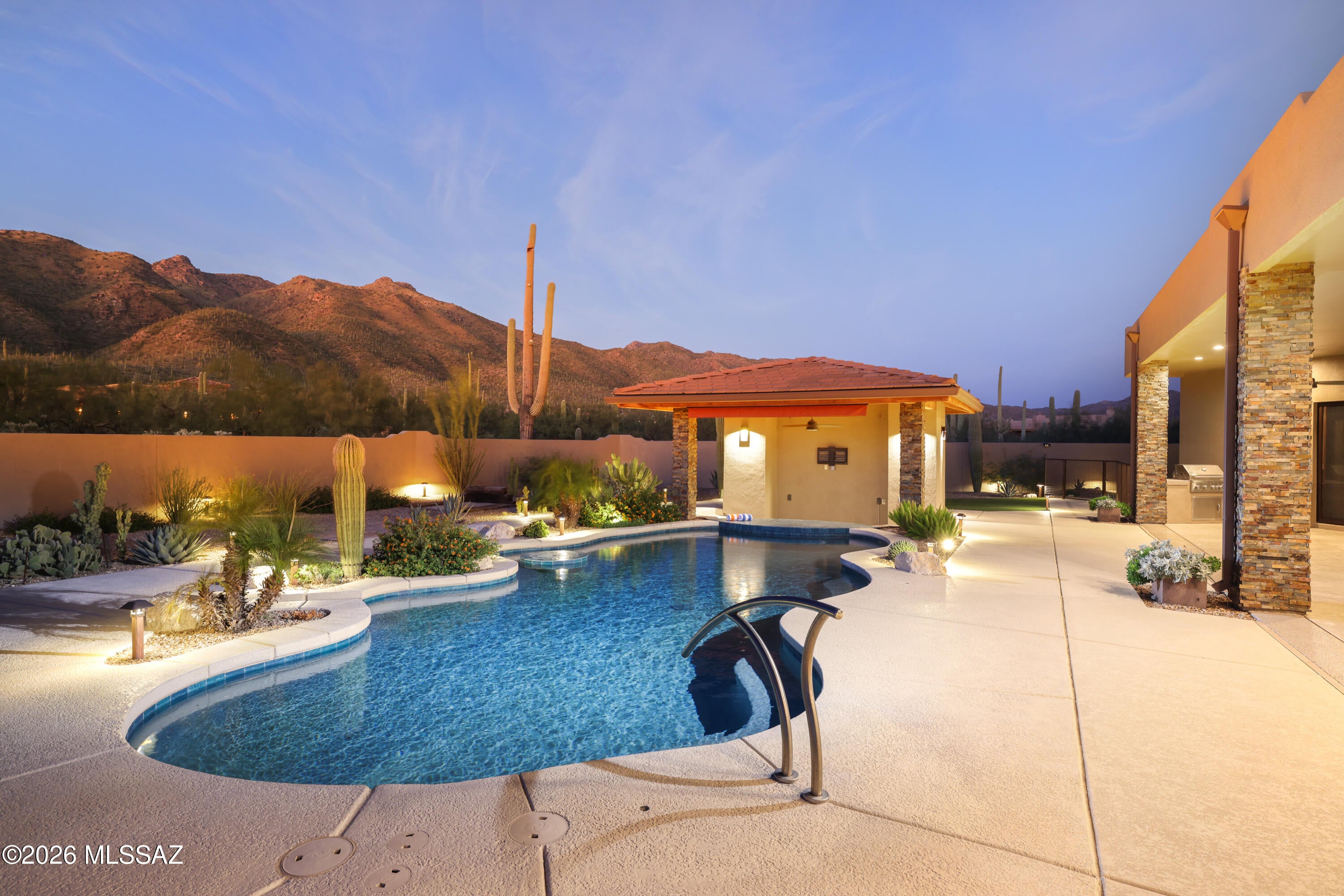 Set against the Catalina Mountains in exclusive gated Fetzer Ranch, this extraordinary 4,738 SF Soloway-designed estate offers an unparalleled Tucson lifestyle on 3.3 elevated acres with Panoramic Mountain & City views. Built in 2019, the residence features views from every window, sophisticated indoor-outdoor living, a gourmet kitchen, linear fireplace, expansive game room, dedicated media room, & a luxurious primary suite. The resort-inspired backyard showcases a custom heated PebbleTec pool with swim-up bar & ramada, outdoor entertainment spaces, enclosed dog runs, & meticulous desert landscaping. A private attached 1,100 SF casita with full kitchen, bath, laundry & garage access provides exceptional guest accommodations. Ideally located near Arizona National Golf Course & Mount Lemmon. THE PROPERTY 
" Exclusive Gated Fetzer Ranch/Saguaro Hills Community 
" Nestled against the Catalina Mountains 
" 3.3 Acre Elevated Lot with Gorgeous Panoramic Views 
" Backyard is Entertainers Paradise with Pebble-tec Pool/Spa 
" Pet Friendly Yard with Snake Proof Wall 
" Desert Landscaping with auto-drip irrigation and accent lighting 
" Freshly Painted Exterior (2024) 
" Roof Coated in 2026 
" Oversized 3-Car Garage with Work Bench - one door with fully retractable/spring-loaded 
screen 
" Near Arizona National Golf Course, Sabino Canyon Recreation Area, Bear Canyon Hiking 
Trails, Agua Caliente Park, & Saguaro National Park East 
" Perfectly positioned at the base of Mount Lemmon for quick and easy access to winter snow 
skiing and summer recreation activities in a cooler climate 
THE HOME  
" Stunning Views of Mountains and City Lights 
" Custom Santa Fe Home, Built in 2019 by Marc Soloway Designs 
" 4,770 Square Feet  
" 2 Bedrooms, 2 Full Baths and 2 Half Baths (Media Room could be 3rd Bedroom) 
" Additional 1 Bedroom, 1 Bath attached Casita with Full Kitchen, Laundry & Separate Entry 
" Split Bedroom Floor Plan 
" Front Door features built-in cross breeze full length windows 
" Viga Beamed Ceilings and 16" thick pine columns 
" Game Room features Custom Shadow Box Bar with sink, bar back, mini fridge, water
repellent carpet, and direct access to backyard pool and patio 
" Pool Table, 16ft Shuffleboard & Electronic Dart Game available on separate bill of sale  
" Dedicated Media Room/Home Theater with Media Lighting for the ultimate Cinematic 
Experience - 4 Reclining Chairs, 80" TV, & A/C Mini-split available  
" Multi-zone Audio System - built-in speakers in main living area, game room, and outdoor 
patio (ramada is prewired) 
" Linear Glass Fireplace in Living Room 
" Large Laundry Room with counter space, storage cabinets, and sink 
" High-end Marvin Wood Clad Windows with screens and Custom Blinds throughout 
" Knotty Alder Interior Doors 
" Fire Sprinkler System 
" Central Vacuum 
" Trane HVAC's and AprilAire Filtration System 
" Water Softener System  
Information on the feature sheet is created for informational purposes only.  Recipients are advised to verify all information. 
IN THE KITCHEN 
" Gourmet Kitchen with ultra-durable Dekton Countertops made from a blend of glass, 
porcelain, and quartz 
" Custom Dining Banquette Seating in Kitchen - Live Edge Table available 
" Large Center Island with Glass Breakfast Bar 
" Stainless Steel GE Profile Appliances - oven/microwave & gas cooktop 
" Frigidaire Refrigerator (stays) 
" Large Walk-in Pantry 
" Custom Built-in Desk 
" Reverse Osmosis 
PRIMARY BEDROOM SUITE 
" Mountain and Pool Views 
" Zero Entry Shower with 2 Heads, Body Sprayers, & Tinted Glass Inlay 
" Dual Quartz Ramp Sinks with Custom Vanity 
" Air Jetted Tub 
" Large Walk-in Closet and Linen Closet 
" Wrought Iron Security Screened Door to Back Patio 
" Access to Dog Run 
BACKYARD OASIS 
" Gated Courtyard Entry with Blink Doorbell 
" Heated Pebble-tec Pool with pop up cleaning system, custom built by Artistic Pools 
" Versatile Swim-up Bar 
" Pool Ramada with drain, retractable Awning, pre-wired Media Lounge, Kitchenette, and Air
Conditioned Half Bath 
" Dog Ramp - dedicated, swim-up dog ramp for pet safety when entering and exiting pool 
" Covered Patio with Epoxy Flooring, 4 Exterior Speakers and pre-wired for TV 
" 10' Pass-Through Window to Backyard with professional tinting and retractable screen 
" Artificial Turf Lawn with Sprinkler System to keep it cool in Summer 
" Separate Fenced Casita Yard 
" Snake Proof Fence with 3-foot concrete subterranean footing 
" 2 Fully Enclosed Dog Runs with drainage system 
Information on the feature sheet is created for informational purposes only.  Recipients are advised to verify all information. 
THE CASITA 
" Private Entry & Garage Access 
" Mountain Views from Every Window 
" Approximately 1,100 Square Feet 
" Full Kitchen with R/O and small Dining Table 
" 1 Bedroom, 1 Full Bath with Zero Entry Shower & Large Walk-in Closet 
" Laundry Closet with Washer and Dryer (stay)  
AVAILABLE ON SEPARATE BILL OF SALE 
" Pool Table  
" 16-foot Shuffleboard Table 
" Electronic Dart Game 
" 4 Reclining Media Chairs