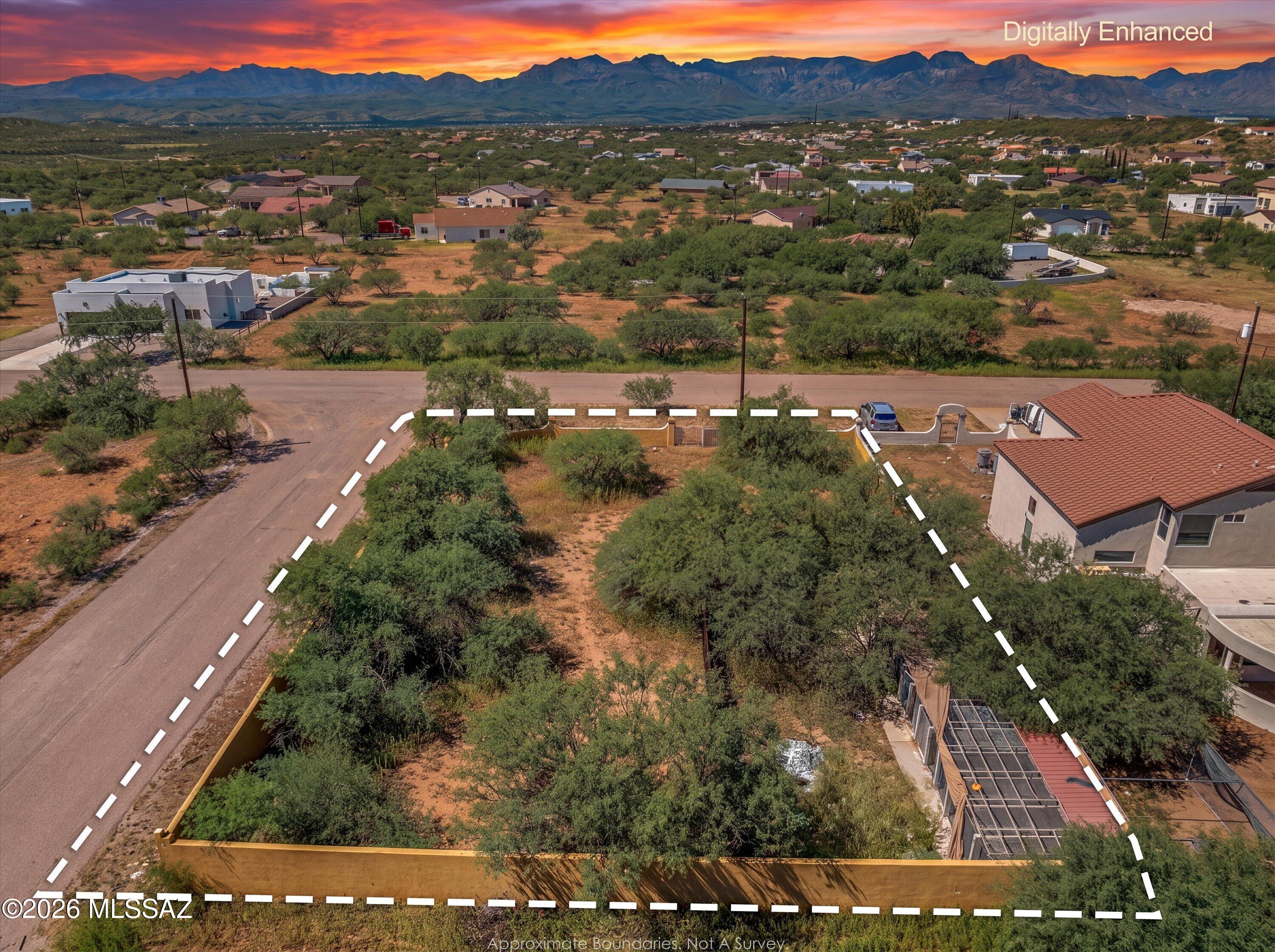 0.27-acre corner lot in Rio Rico with beautiful views of the Santa Rita and San Cayetano Mountains! This flat, fully usable lot offers paved road access with utilities available to lot. Fully fenced with a block wall and double-gate access from Circulo Mexicali. Property also features an existing 10-space kennel with concrete foundations, chain-link fencing, and sun protection. Great opportunity with usable land, existing improvements, and utilities ready for your future plans. Looking for a ready-to-use lot to build your future in Rio Rico? Come see this property and imagine the possibilities!