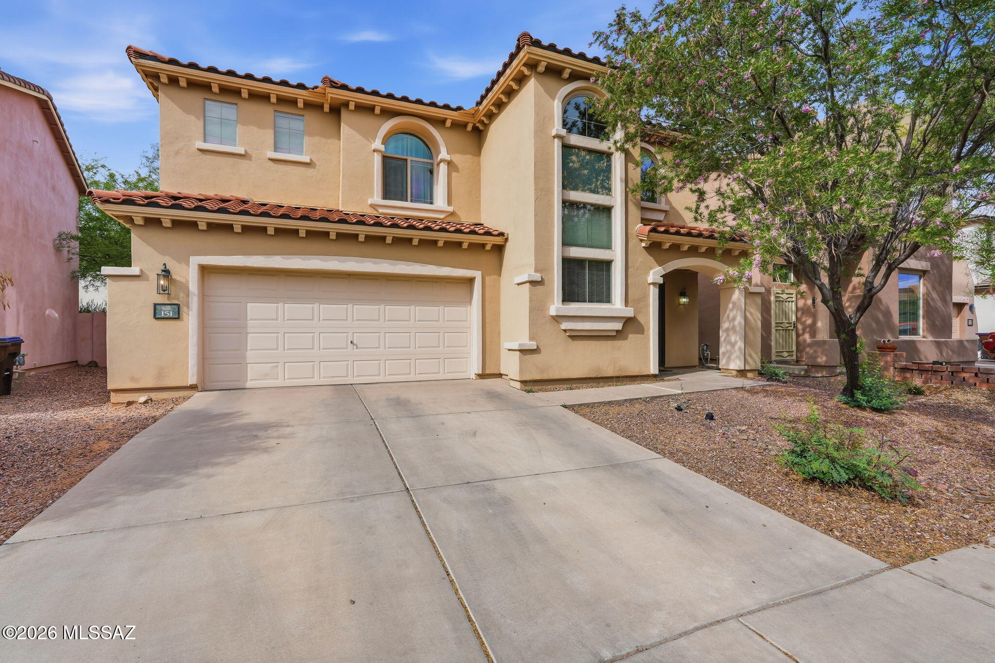 Welcome to this spacious 4-bed, 3-bath home in the highly desired Rancho Sahuarita community with a newer HVAC (2023). The flexible floorplan features a first-floor bedroom with a full bath, perfect for guests or multigenerational living. Enjoy a bright living area, a kitchen with Newer Appliances (2023) including a gas range, pantry closet, and a breakfast nook. Upstairs offers a convenient 2nd-floor laundry, generous bedrooms, and a primary suite with double vanity, shower and walk in closet. The backyard includes covered patio and low-care landscaping. Rancho Sahuarita residents enjoy a lake, parks, pools, splash areas, fitness facilities, sports courts, and miles of walking trails.  An incredible lifestyle in a vibrant community.