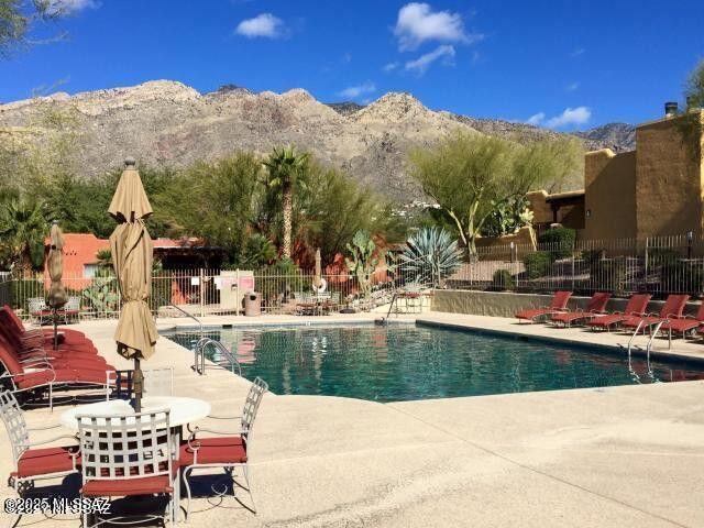 Private ground floor 2BD/1BA Catalina Foothills condo in the popular resort-style community of Reflections In The Catalinas. This spacious condo has recently been remodeled and includes SS appliances, new double-pane windows and slider, open layout, split bedrooms, washer/dryer in condo, large outdoor patio and convenient Northern Tucson location near shopping & restaurants. The Reflections In The Catalinas includes a heat pool & spa, clubhouse, exercise facility and community bbq grills.