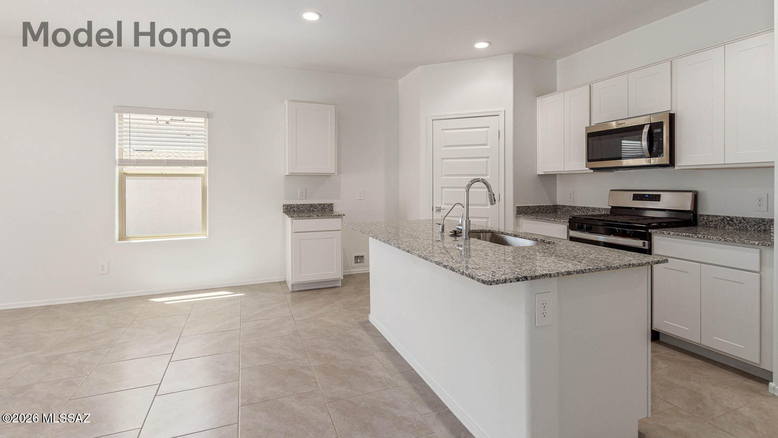 This floor plan offers 1,635 square feet of well-planned living space, perfect for those who appreciate both comfort and functionality. With four bedrooms, two bathrooms, and a 3-car garage, The Elgin provides the ideal setting for modern living amidst the beauty of the Santa Rita Mountains.

As you enter through the inviting front porch, you're welcomed by an open and airy floor plan that flows effortlessly from one room to the next. The heart of the home is the expansive great room, seamlessly connected to the dining area and kitchen, making it ideal for everyday living and entertaining. The kitchen is a chef's delight, featuring a large island with a breakfast bar, granite countertops, and Shaker-style cabinetry, offering ample storage and workspace.