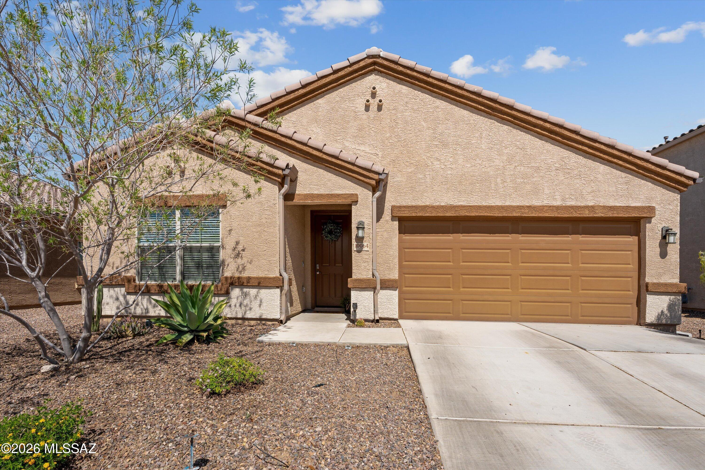 Home, sweet home! Located in the desirable Saguaro Bloom, this beautiful home offers 4 beds, 3 baths, plus a den and a 2-car garage. The interior showcases inviting living spaces, perfect for both everyday comfort and effortless entertaining. The kitchen is equipped with everything you'll need for home cooking, boasting built-in appliances and cabinetry for ample storage. Enter the main bedroom to find a private bathroom for added convenience. The large backyard, with a covered patio, is the ideal spot to relax or enjoy BBQ. Living in Saguaro Bloom provides a vibrant community with scenic desert surroundings & top-notch amenities, including a resort-style center, pools, splash pad, fitness center, parks, and walking paths.