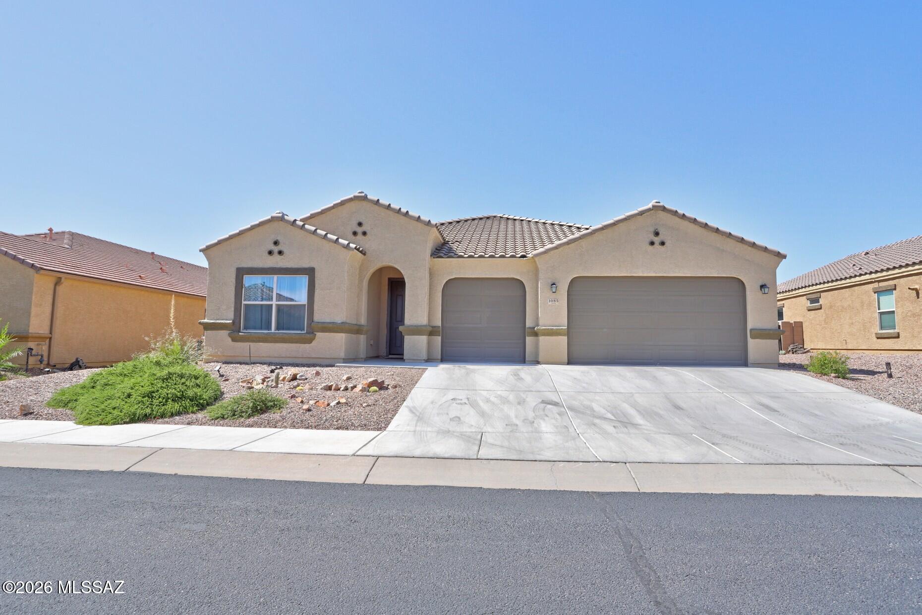 You'll look forward to coming home to this stunning, 4 bedroom, 3 bath, home! Enjoy preparing delicious delights in the gourmet kitchen that includes stainless steel appliances, walk in pantry, granite counter tops, Island breakfast bar and water purification system. Great room concept with adjoining dining room and separate flex-space. Primary suite with a large walk-in closet, and an adjoining dual vanity bath featuring a walk-in shower. Upgraded ultraviolet HVAC air purification system, surge protection and emergency over-flow pan. Relax in the landscaped backyard, featuring a paver patio with walkways, a charming gazebo, and artificial grass. Accented by a decorative retainer wall with cactus, mature shrubs and decorative rock. Quite neighborhood and low HOA! Enjoy near-by Anamax Park and Recreation Center.  A great place to call Home!