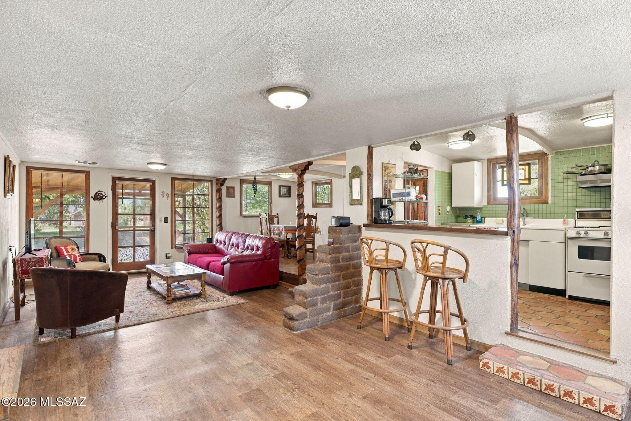 Charming 2 bedroom, 1 bath bungalow with mountain views, just 3 miles off I-10 on paved Dragoon Rd. This doll house of a home has an open concept layout where the living room, dining area, breakfast bar and kitchen flow together. It has operated as a seasonal vacation rental, usually September through May, so it can work as a full-time home, a second home or a rental. Dragoon sits in the middle of some of Cochise County's favorite spots, with Texas Canyon, the Amerind Museum and Cochise Stronghold nearby and Benson, Willcox and Tombstone an easy drive. No HOA. Come see it in person. This little home has the vintage charm of a 1950s bungalow in a quiet high desert setting. Enjoy wide open skies, mountain views and room to breathe, while still being minutes from the freeway. It's a great fit for someone looking for a peaceful full-time home, a seasonal escape or a place to host guests.

A rail line runs nearby, but Dragoon is a designated quiet zone, so trains generally only sound their horns when something is on or near the tracks. This sale is the residence only. The neighboring commercial building is not included but will be offered for sale separately in the future.