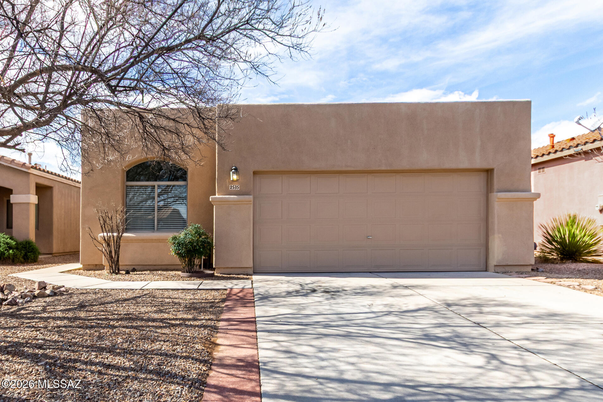 Welcome to this inviting 3-bedroom, 2-bath home featuring a desirable split floorplan that offers both privacy and functionality. Filled with abundant natural light, the interior feels bright and airy throughout. Tile flooring in all high-traffic areas adds durability and easy upkeep, while the thoughtfully designed layout makes everyday living comfortable and practical.

The interior of the home and the garage have both been recently painted, giving the property a fresh, updated feel. Step outside to a low-maintenance yard, perfect for enjoying Arizona living without the extra work. Residents also enjoy access to a gated community pool and spa -- ideal for relaxing and soaking up the Arizona sunshine.

Conveniently located with quick access to the freeway, grocery stores, and shopping