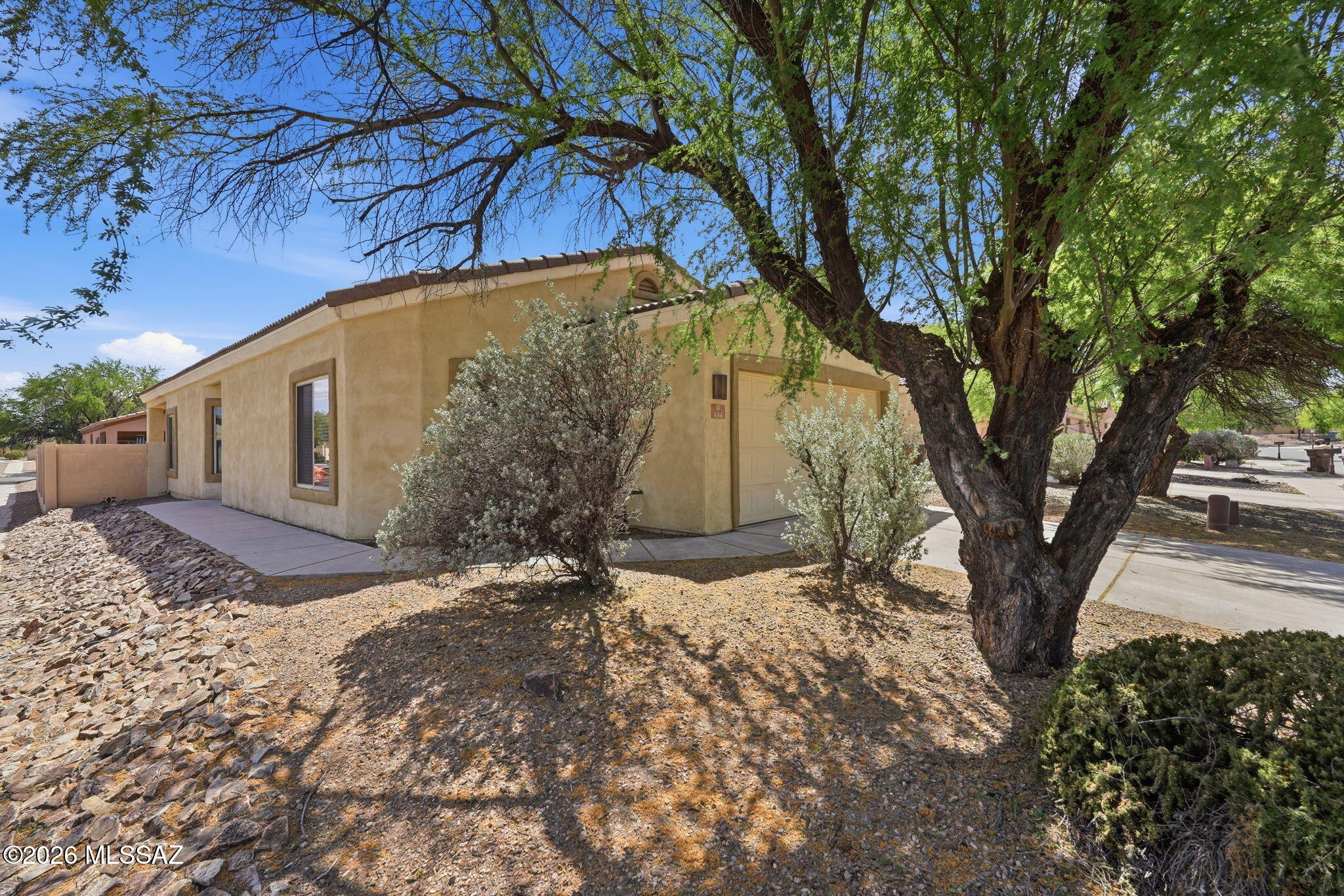 Great opportunity in the desirable Rancho Sahuarita community with ALL of it's GREAT amenities! This single-story 3 bedroom, 2 full bath home features NEW CARPET in the bedrooms, tile throughout the living areas, a split bedroom floor plan, 2-car garage, and FRIG, WASHER & DRYER included!! The backyard can be the retreat of your dreams. Comfortable, easy living with access to outstanding neighborhood amenities including community pools, splash park, Sahuarita Lake, parks, playgrounds, walking and biking trails, fitness center, and a lively community center with year-round events. Make this one yours today!