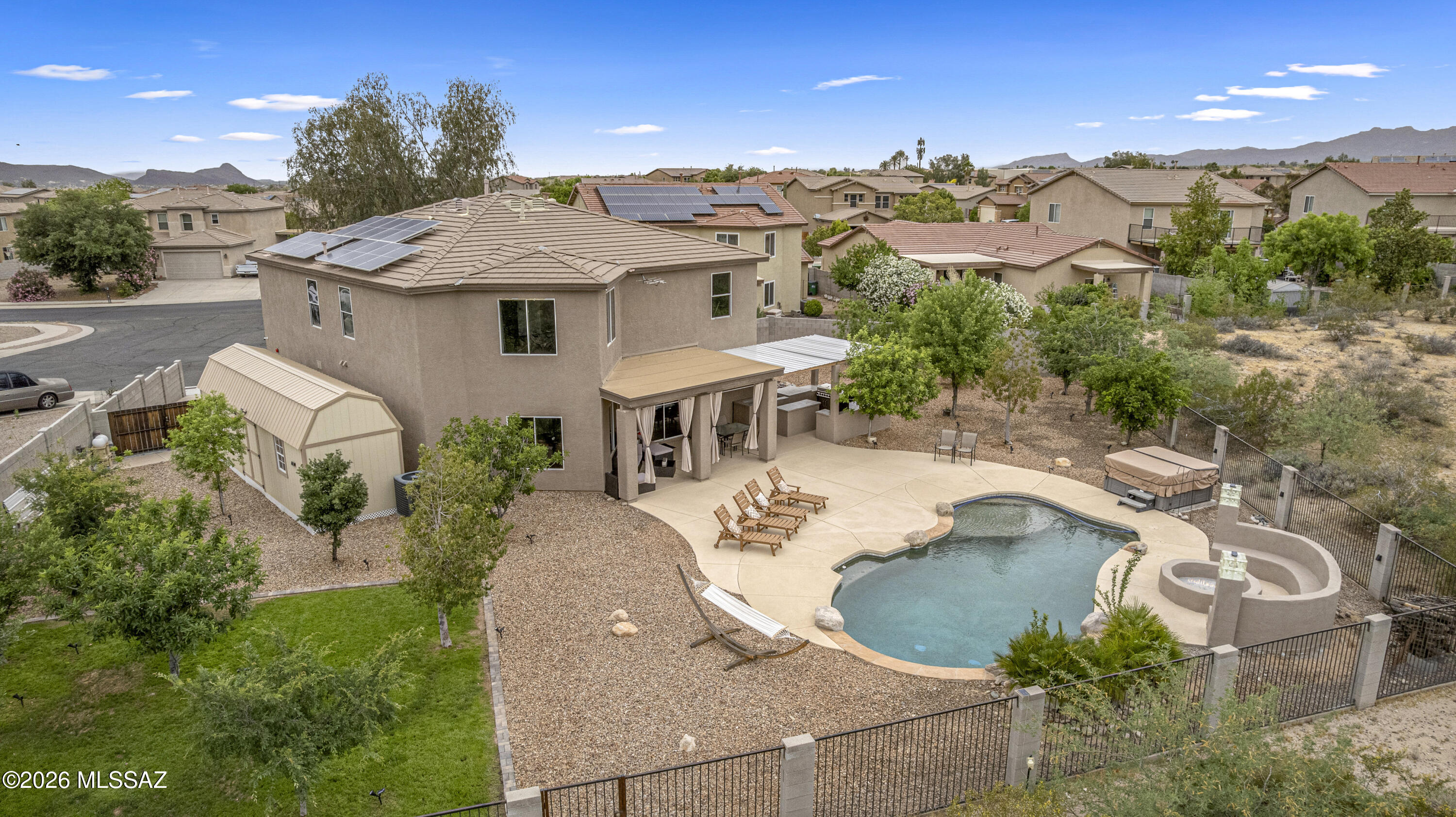 Move-in ready with smart technology, luxury upgrades, and exceptional indoor-outdoor living. This beautifully updated 2-story, 3,090 sq ft home features 4BD/ 4BA, and a 2-car garage on one of the largest lots in the neighborhood. The chef's kitchen features Samsung smart appl. system, granite counters, gas dual-door convection oven w/family room off kitchen.Engineered wood floors upstairs (excluding theater), new fans,HVACs and water heater new in 2023. Enjoy stunning Catalina Mountain views from the backyard oasis with a Pebble Tec pool, spa, waterfall, fire pit seating, and covered patio with outdoor kitchen, gas/charcoal grills, and smoker. This family home & location will likely Check all the boxes that you are looking for !! TEP OWNED SOLAR. NO LOAN BALANCE. Near Arthur Pack Park, The Loop, shopping, dining, Marana schools, and close to multiple I-10 access choices. To top it off, enjoy great budget savings with TEP owned solar.