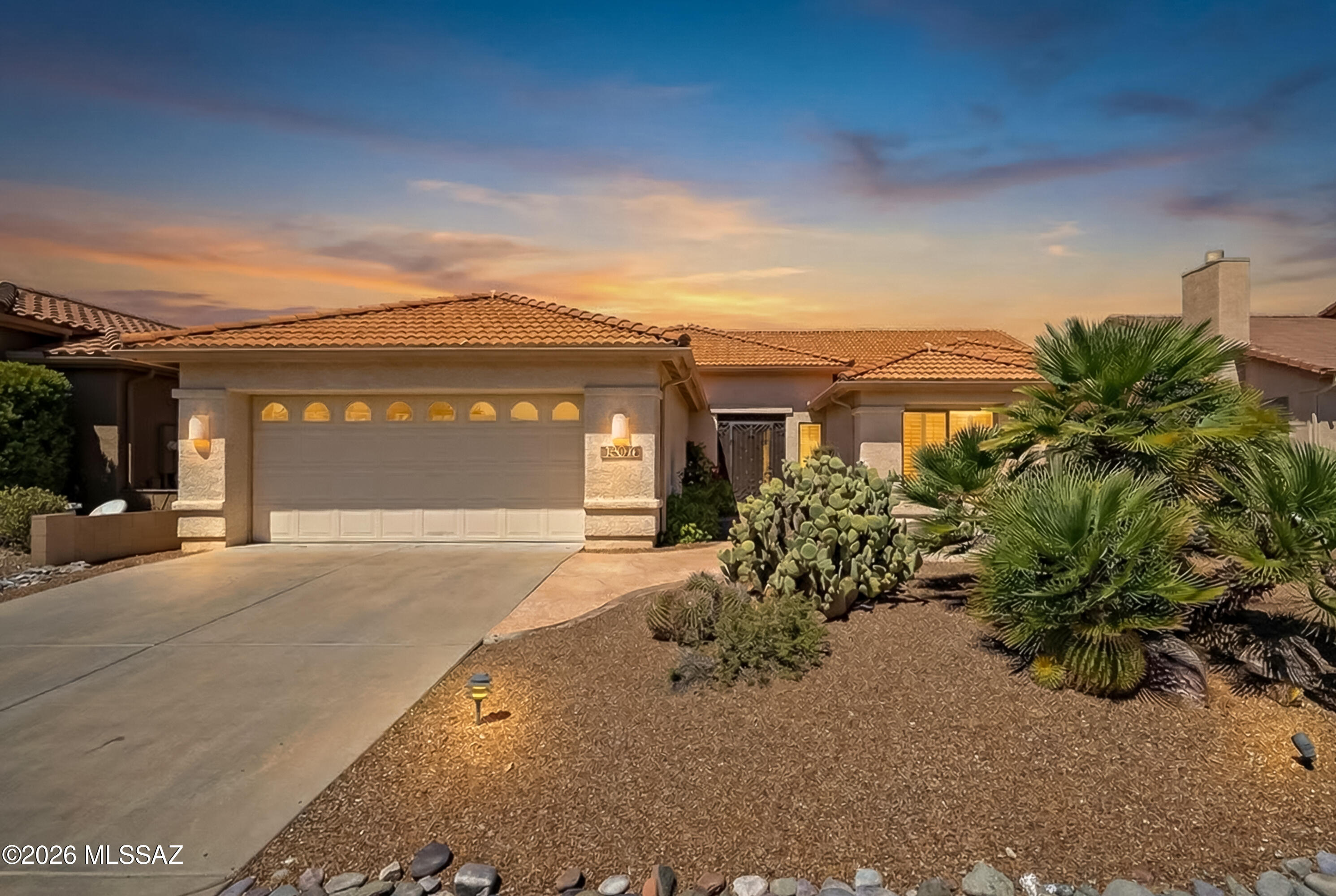 Magnificent Montana model with amazing views of the golf course and natural desert.  You are greeted by a front yard patio and custom iron front entry door. The open floor plan, vaulted ceilings, and large windows overlooking the backyard create a light and airy ambiance. Great room design with upgraded wood-like porcelain tile floors throughout main areas plus large dining room perfect for entertaining.  Remodeled kitchen includes custom designed wood cabinets and hardware, incl. 13'' deep upper cabinets, granite counters, enlarged center island, two glass front cabinets with lighting, built in wine holder, under cabinet accent lighting plus lighting above cabinets, custom tile backsplash, stainless steel appliances, and sunny breakfast nook.  Primary suite includes remodeled bath with new custom wood vanity, dual sinks, designer tile, mirrors and lighting plus updated shower with thick glass wall and door plus generous sized walk in closet. Guest bath features new vanity and upgraded lighting.  Two additional bedrooms + den allows for plenty of room for hosting family/guests. The backyard is the perfect spot to relax and take in the views from the extended covered patio with two ceiling fans or enjoy sitting by the outdoor kiva style fireplace.  Flagstone walkway, low care landscaping, and open space make for fabulous outdoor living.  Extended garage with 6' extension plus full length built in storage cabinets, workbench and utility sink. Quiet neighborhood but active social committee for the unit.  Don't miss this fantastic home.