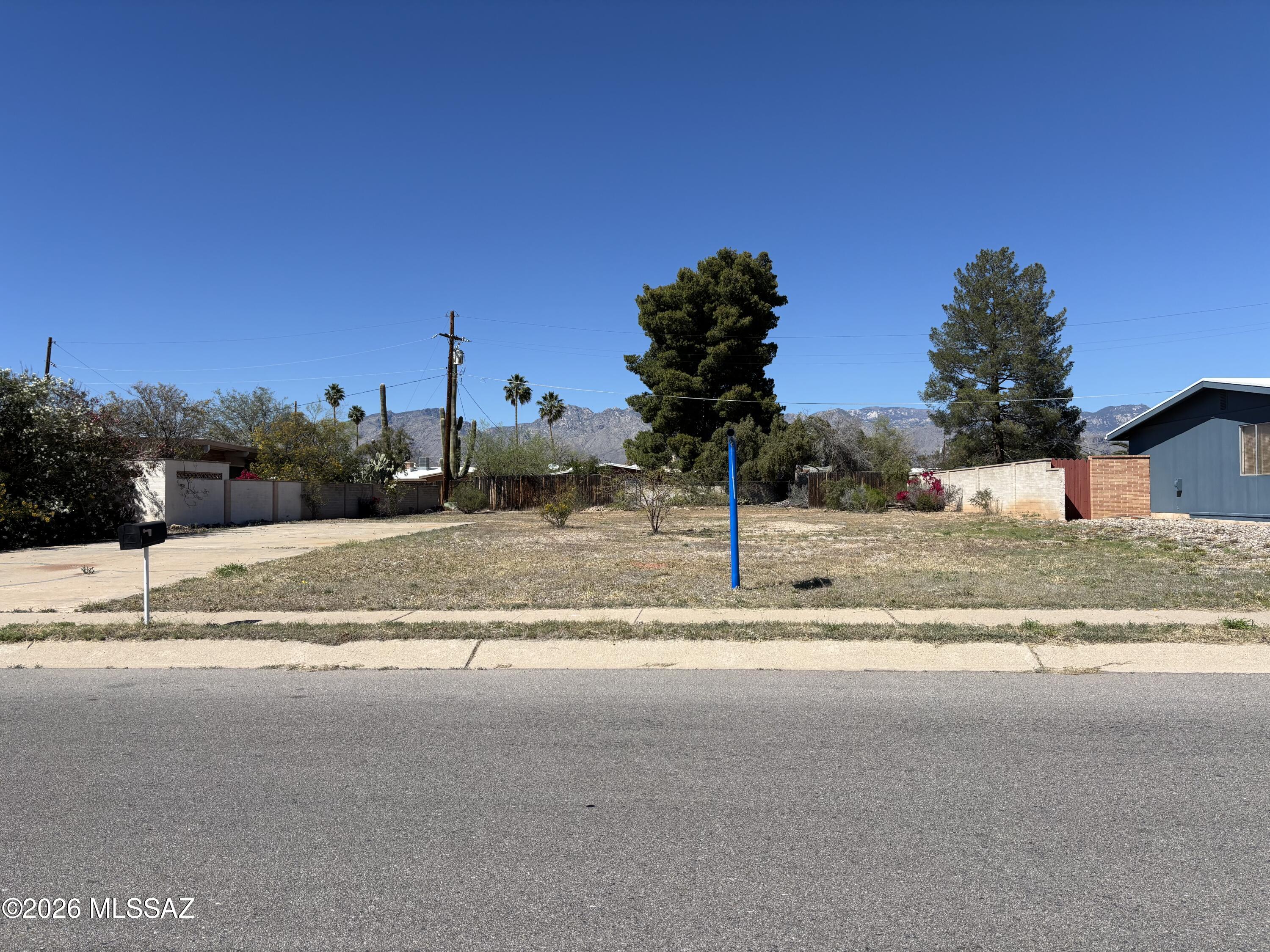 Fully improved 10,367 sq. ft. lot (approx. 0.24 acre) all utilities in place: TEP, Tucson water, sewer, gas and cable. The parcel was platted in 1964; a home built soon after but burned down approximately 2010 and all of the structure including the foundation have been removed. The zoning is R-1 with opportunity to add an Accessory Dwelling Unit (ADU). Ideal for designing your own floor plan to current codes and modern materials. Mature neighborhood, no HOA, eastside location
with north/south exposure and mountain views. East and west common masonry walls remain. Close to Udall Park, restaurants, shopping and medical centers. Rare opportunity to build your own home.