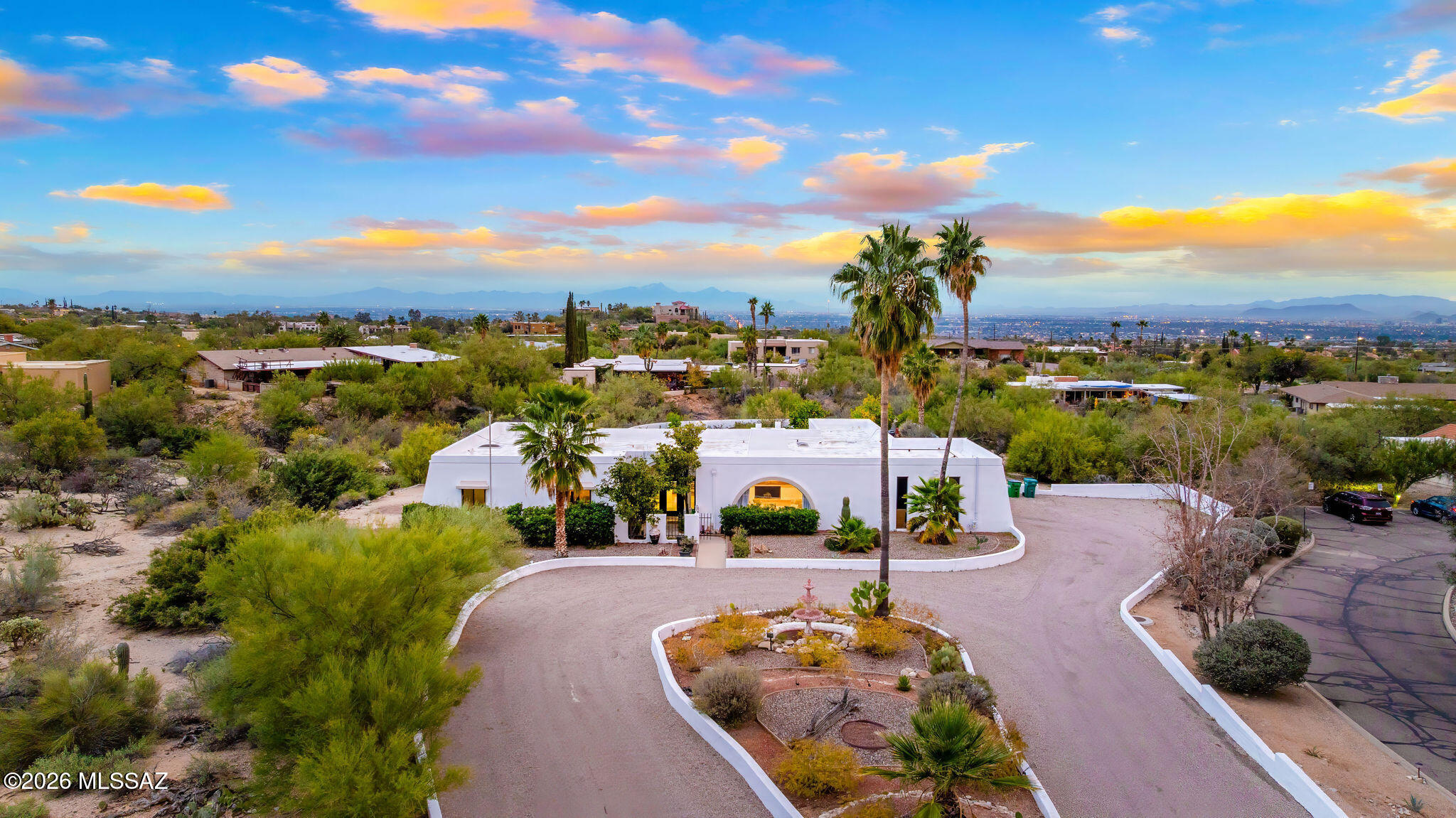 Unique opportunity for mid-century modern 4 bed/3 full bath, split floor plan, 3,631 SqFt home on massive 1.93 acre premium lot providing omnipresent Catalina mountain views in desirable Skyline Bel Air Estates, located in the vaunted Catalina Foothills school district in North Tucson. Enjoy the best of both worlds, the vintage character and charm of a single story (no stairs/no steps) 1970 masonry stucco Territorial home with 644 SqFt finished 2 car attached garage, 241 SqFt attached enclosed Arizona room, updated modern amenities, refreshing diving depth pool, sweeping city and panoramic Catalina mountain views. Enjoy multi-generation living with dual primary bedroom suites, each with a private ensuite bathroom. This thoughtfully improved residence offers a rare blend of significant recent investment and future design opportunity, making it ideal for buyers seeking a refined foundation with room to elevate further.
The home has been meticulously refreshed with major system and cosmetic updates already completed allowing the next owner to focus on personalization rather than costly infrastructure.
A striking first impression is set by the modern black metal French entry doors with vertical glass panes, offering architectural presence and natural light. Inside, the home feels bright and refreshed with new carpet, LED recessed lighting, and a full interior repaint completed in 2025. Inside buyers will appreciate two newer gas HVAC systems providing efficient, zoned climate control throughout the home. Newly installed Anlin windows deliver 99% UV protection and come with a lifetime warranty, enhancing both comfort and long-term value. The main primary bathroom has been fully renovated with a spa-inspired soaking tub, dual-sink full-slab quartz modern vanity, new ceramic tile flooring, and updated fixtures creating a serene, modern retreat.
The open concept kitchen features freshly painted cabinetry with updated hardware, Sub-Zero fridge, unique indoor grill, built-in shelving, adjacent formal dining area, breakfast/coffee bar that offers a clean, contemporary look while leaving room for future customization. Additional improvements include a new dishwasher, dual water heaters (one newly installed), and a new vanity in the third bathroom.
An oversized laundry room with utility sink, abundant storage, washer & dryer convey and direct yard access adds everyday functionality rarely found in homes of this caliber.
Major exterior investments have already been completed, including a professionally recoated flat roof, new roof underlayment with updated tile roofing, and new skylights that enhance natural light throughout the interior.
The garage features a professionally installed new garage door, additional storage and an epoxy-coated floor, reinforcing both durability and visual appeal.
Fresh, professionally designed landscaping frames the home, supported by a new irrigation system with multiple zones in both the front and backyard ensuring long-term ease of maintenance.
Affordable $30 monthly HOA dues include community pool and tennis courts.
Convenient Foothills location in District 16 School district, minutes away from shopping and fine dining at La Encantada in The Catalina Foothills. Sellers have spent over $100K on updates, upgrades and improvements to property since 2023 and it shows! Dare to compare, priced at only $238.2 per SqFt! Whether you are a local Tucsonan or a seasonal visitor looking for desert retreat, call to make your appointment to view this unique property today!
