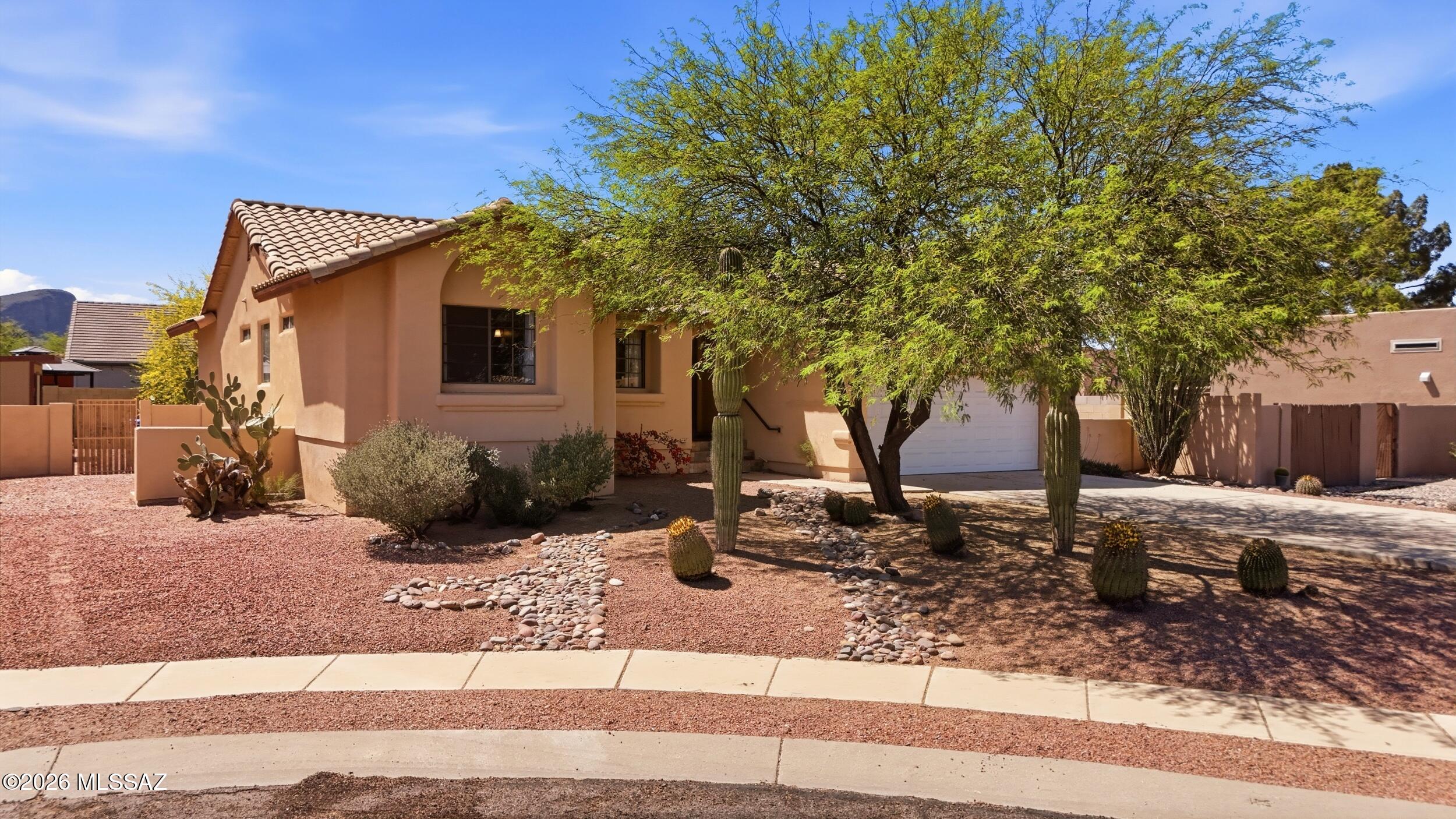 Ever wanted a basement in Tucson? Your search is over! This spacious 5 bedroom, 3 full bath home in cul-de-sac offers a versatile layout ideal for multigenerational living. The main level features the primary room along with 2 bedrooms and 2 bathrooms, while the fully finished basement downstairs includes 2 bedrooms, 1 full bath, the laundry room, and a large great room complete with a cozy wood-burning fireplace, perfect for a game room, family room, or entertaining space.

The backyard is designed for relaxing and gathering, featuring a charming koi pond and plenty of room to enjoy Arizona living. 

This home is full of character, space, and flexibility, truly a rare find. 

Community offers 2 pools, rec center, parks, basketball, baseball, skate board ramps & walking trails New roof to be installed prior to close of escrow. Existing polybutylene plumbing will be replaced with new plumbing with an acceptable offer.