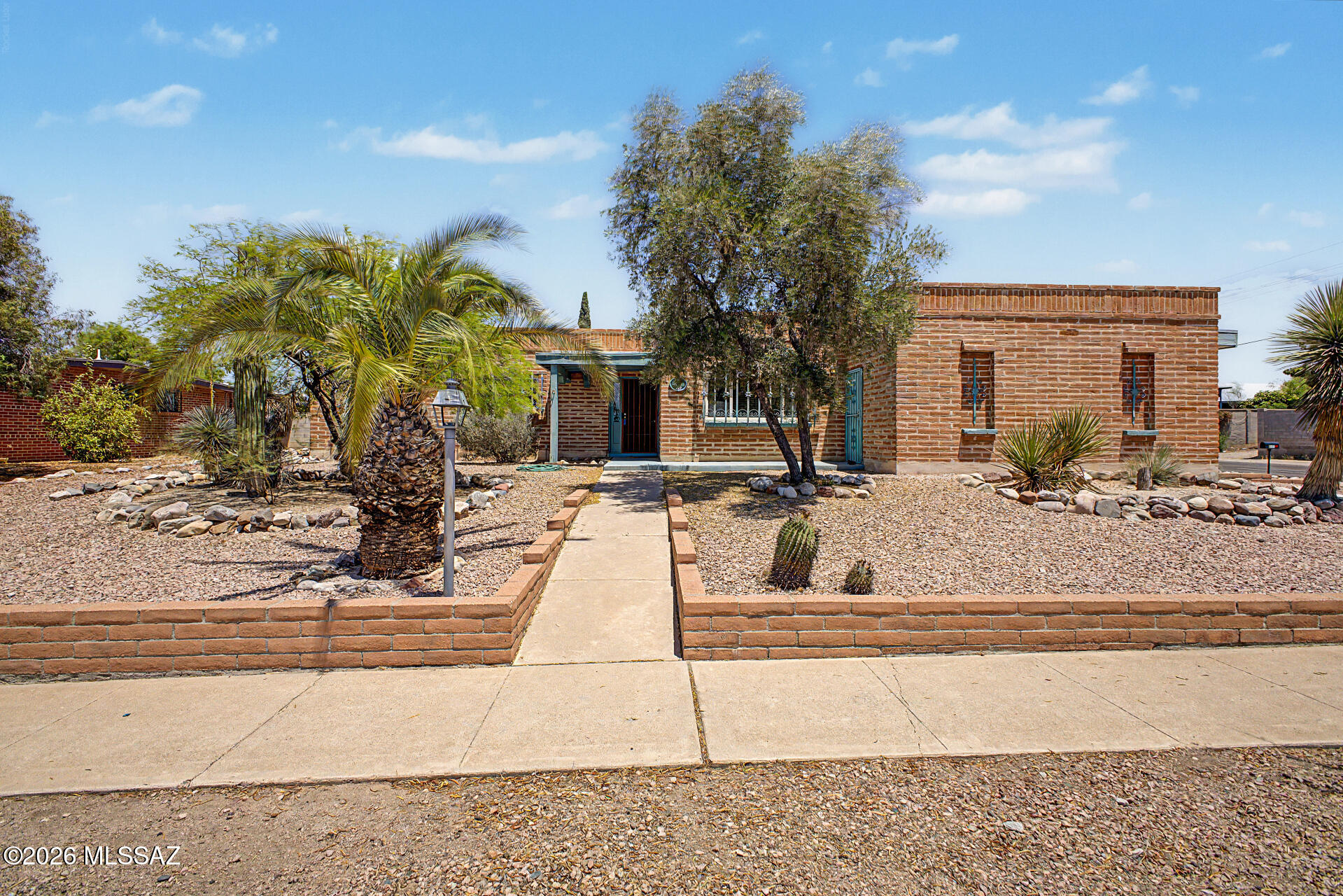 Lovely four bedroom/ 2 bathroom slump block home close to schools, shopping and bus routes. Lovingly maintained, featuring large living areas including a formal living room, dining area and family room/great room. Open kitchen with breakfast bar, gas oven and plenty of counter space. Large laundry room with pantry closet and door to pool area. Sliding door out to the long covered patio and pool area makes a great entertaining space. Workshop off the patio for all of your home projects. Two car garage.