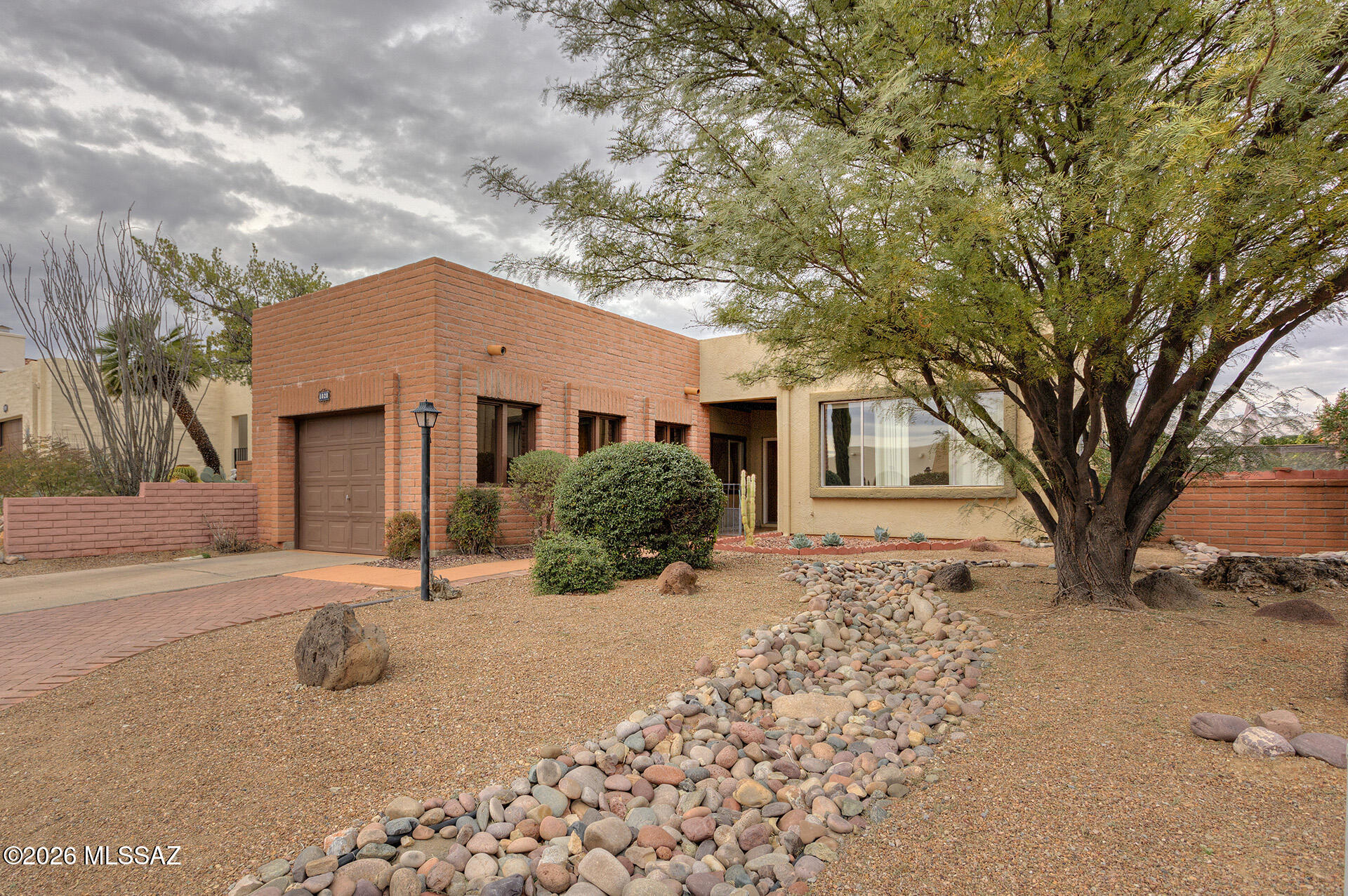This Desert Hills townhome features two bedrooms, 2 full baths and a lovely bonus Arizona room perfect for hobbies or entertaining. The back yard is a paradise with native plants, fruit trees, a covered patio and so peaceful. The kitchen has lots of storage and quartz counters. The attached garage is light and bright and has more storage. Don't let this one slip away. Enjoy your navel orange, mandarin orange, and lemon trees