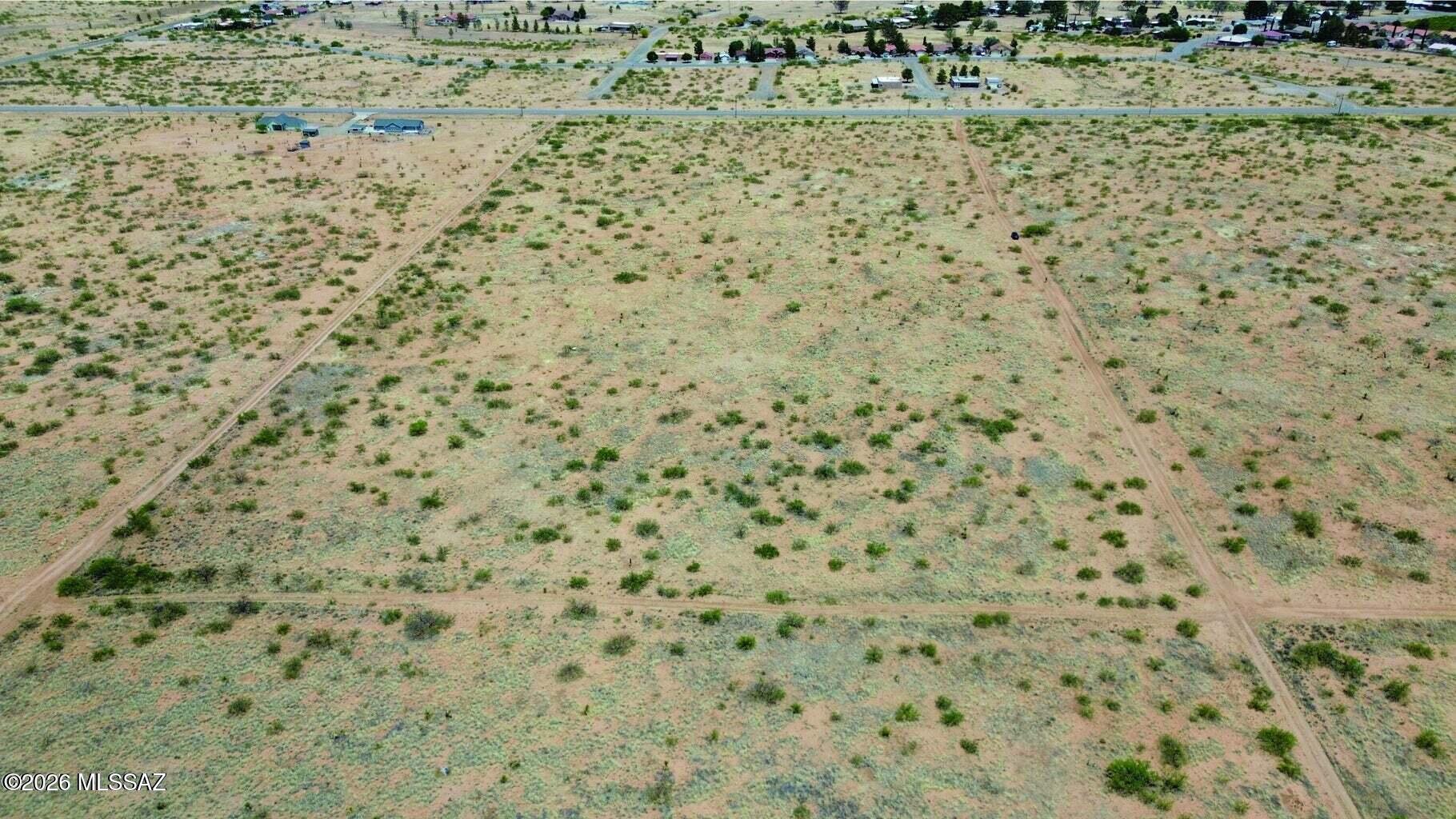 Over 2.5 Acres of Opportunity with Mountain Views & No HOA!

Discover the possibilities on these three combined parcels offering over 2.5 acres of level, buildable land with convenient road access and breathtaking views in every direction. Enjoy panoramic vistas of the majestic Dragoon Mountains and surrounding farmland right from your own property. With no HOA and utilities nearby, you have the flexibility to create your ideal Arizona retreat, build your dream home, or explore the option of a manufactured home. Located within a master-planned community and zoned Cochise County SR-22. Bring your vision and take advantage of the space, views, and freedom this property has to offer!

Buyer to verify zoning, permitted uses, utilities, access, and all development requirements w Cochise Cou Cochise County, Arizona, the SR-22 (Single-Household Residential) zoning district requires a minimum parcel size of 22,000 square feet (approximately 0.5 acres). It permits low-density, single-family detached homes, but strictly prohibits mobile homes, manufactured homes, and recreational vehicles from being used as primary residences.Permitted Uses Primary Residences: Single-family detached dwellings.Accessory Uses: Guest houses, home occupations (with limitations on traffic, noise, and outdoor storage), and private garages/workshops.Other Uses: Religious institutions (churches), utility installations, and residential care homes. 

Yes, Cochise County allows you to live in an RV on an SR-22 zoned property while building a home, provided you obtain a Temporary Use Permit from the county.