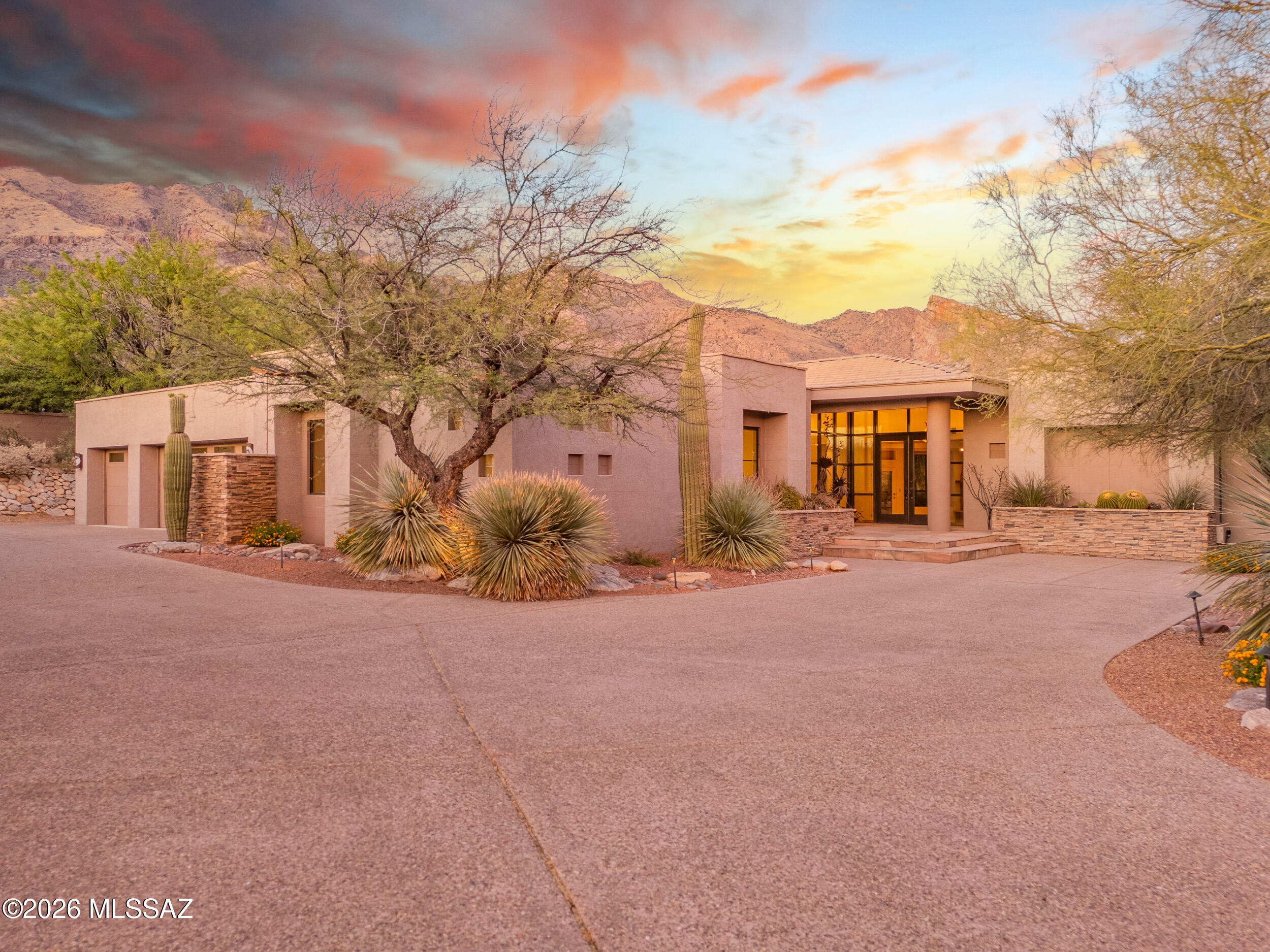 Tucked away at the end of a quiet cul-de-sac in the highly sought-after Cobblestone community, this exceptional 4-bedroom, 3.5-bath residence offers just under 4,000 square feet of thoughtfully designed living space on an expansive .86-acre lot. Located within a guard-gated neighborhood, the privacy here is truly unmatched--creating a serene retreat that still feels connected to everything Tucson has to offer.

Step inside to a well-executed split floorplan that balances comfort and functionality, with generously sized living areas that flow seamlessly for both everyday living and entertaining. Freshly updated with brand-new paint and carpet throughout, the home feels light, clean, and move-in ready. The kitchen presents a rare opportunity, a blank canvas ready to be transformed into your into your dream culinary space, tailored perfectly to your style and needs.

The northeast-facing backyard is where this home truly shines. Enjoy breathtaking mountain views complemented by subtle city light vistas, all from your private outdoor oasis. The pool and spa create a resort-style atmosphere, while a peaceful nature path just beyond your property invites you to unwind with a morning walk or evening sunset. A dedicated viewing bench offers the perfect spot to take in the surrounding wildlife and natural beauty.

Additional highlights include a spacious 3-car garage, central vacuum system, electric rolling shutter screens, and a soft water system. The home is also equipped with a 3-year-old leased solar system that significantly reduces monthly electric costs. The lease is transferable to the new owner and includes the added benefit of a 10-year roof warranty. For added peace of mind, the HVAC systems have been meticulously maintained with semi-annual servicing.

This property blends space, privacy, and potential in one of Tucson's most desirable gated communities--offering a lifestyle that feels both elevated and effortlessly livable.