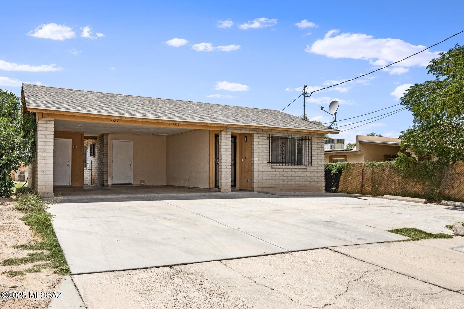 Just improved $5,000! FHA/VA eligible investment duplex for sale in Tucson, AZ, ideal for new and seasoned investors and house hackers. Why buy this Tucson duplex? Under-market rents mean strong upside to increase income from day one, and a pre-listing appraisal at $360,000 offers instant equity. Both 2 bed, 1 bath units feature updated kitchen cabinets, stainless steel appliances (electric stove, microwave, dishwasher), upgraded LED lighting, fresh paint, and durable tile flooring. Unit 707 has a tub/shower combo; Unit 709 offers a walk-in shower with built-in seating and retextured ceilings. Recent updates include a new evaporative cooler, water heater, newer gas furnaces, and a recently replaced roof. Neighboring duplex at 3102 S Sunset Villa also available.