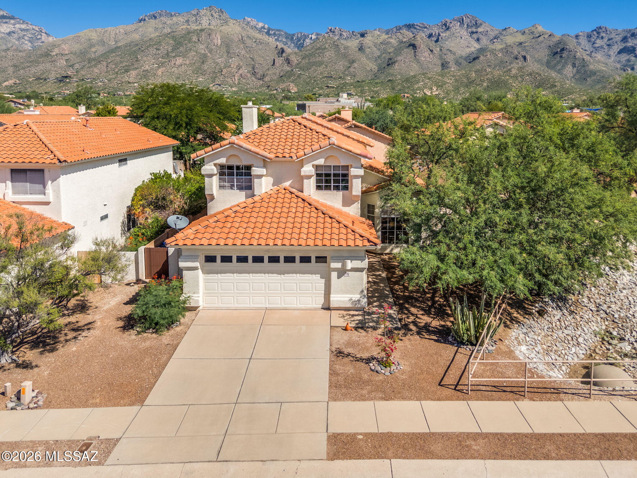 RANGE PRICING:  $560,000-$570,000. Enjoy the easy rhythm of Tucson living in this 4-br, 3-ba home offering 2207 sf of comfortable, flexible space.  Soaring ceilings create an airy feel in the living room, while the family room flows naturally from the kitchen for everyday living and gathering.  With a kitchen feaaturing a newer stove with an electric double oven and gas cooktop, baking will be a dream! A main-level bedroom offers added versatility for guests, a home office, or a den.  Step outside to an extended patio and spacious, low-care yard with room to relax, dine outdoors, and enjoy Tucson's sunshine.  Conveniently located near Sabino Canyon, shopping, dining, and recreation, this inviting home puts outdoor adventures and everyday essentials within easy reach.