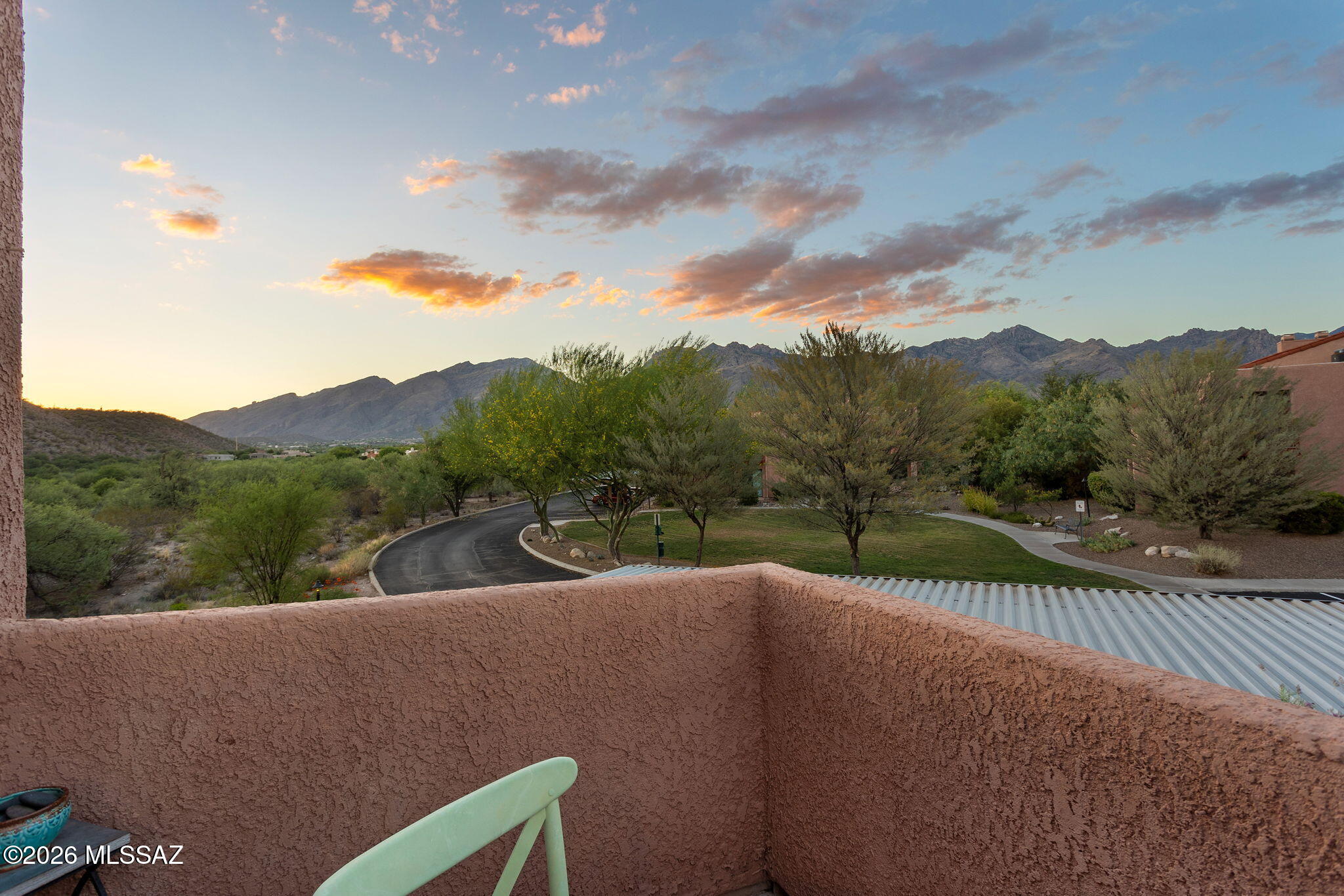 Enjoy views of the Catalina Mountains from your balcony! Move in ready condo with many features including wood burning fireplace, tile flooring throughout, Corian countertops in the kitchen, tile counter tops in bathroom and tile surround in shower. Vaulted ceilings with highlight windows for lots of natural light. New HVAC system installed in 2024 and new water heater in 2025.  Gated community with resort style amenities including pool, recreation room, tennis court, pickleball, and 2 spas. OWNER/AGENT.
