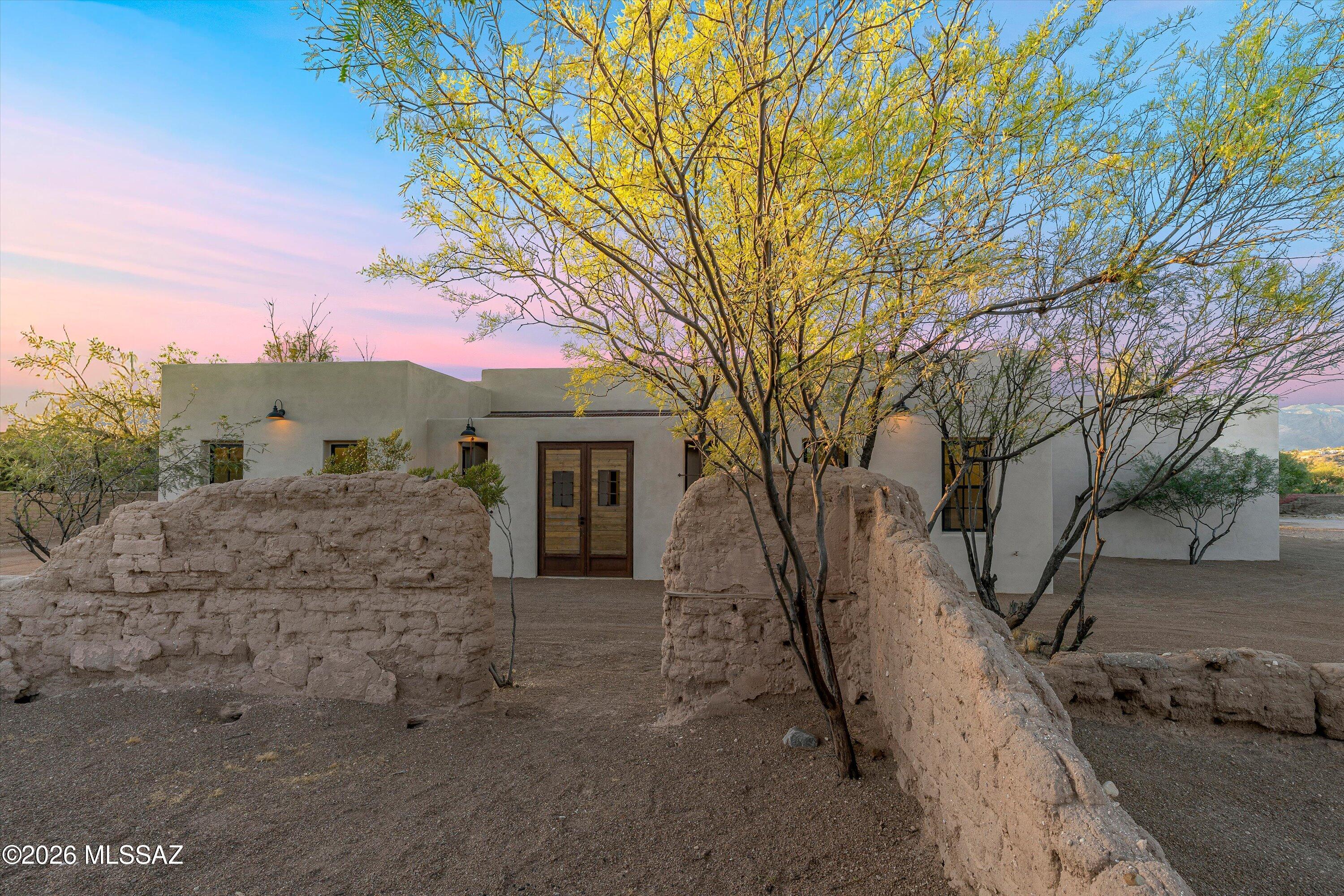 Tucked away just rear of the existing 1908 old adobe School House ruins and sun-dried adobe brick walls that sit gently north and west of the property, this beautiful newly constructed home reflects the lands rich preserved history in Tucson's Old Fort Lowell Historic Neighborhood. As you step onto the property you're taken back to the village of El Fuerte, aka ''The Fort'', where the Old School House was built for the children of the community, across the street enjoy views & a short walk to the Historic San Pedro Chapel. A unique and rare preserved piece of history that welcomes you day to day with serene desert living beauty & relaxation. 9-10 ft ceilings, modern open concept living, gorgeous kitchen with waterfall island, elegant quartz countertops, plentiful cabinetry, a spacious walk-in pantry, rustic wood beams, and a courtyard pool, all so perfect for family gatherings & entertaining. Each ensuite shows attention to design work & detail providing comfort, privacy & space for all. Study/office offers flexibility to work from home or use as a creative bonus room. Exceptional craftmanship throughout shows the dedication, time & commitment in the design build of this beautiful new home, in keeping with timeless preserved historical significance this property holds, a true rich value in itself. Seller licensed to buy/sell real estate in state of AZ, Owner/Agent; Listing Agent has a financial interest in property, treat as Owner/Agent. Please do not enter adobe ruins. *Construction final/pending: required security pool wall is in process to be completed; use caution in pool area (not yet filled).