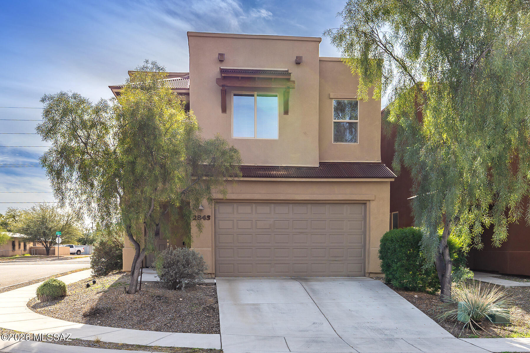 Former model home built in 2015 by Miramonte Homes, this beautifully upgraded residence offers 4 bedrooms, 2.5 bathrooms, and 1,975 square feet of thoughtfully designed living space in an exceptional central location near Glenn and Mountain.
The main living area is open and inviting, featuring a spacious great room that flows seamlessly into the dining area and gourmet kitchen. The kitchen is well appointed with upgraded cabinetry, granite countertops, and a generous walk-in pantry, making it ideal for both everyday living and entertaining.
The primary suite is a private retreat with a luxurious bath offering dual sinks, a separate garden tub, an oversized walk-in shower, and abundant storage with a walk-in closet plus two additional closets. Three additional bedrooms provide flexibility for guests, office space, or family needs. The fourth bedroom features its own balcony with lovely views of the Catalina Mountains. As a former model, the home includes upgraded finishes throughout and a thoughtful layout that balances comfort and functionality. Ideally situated less than a mile from restaurants, grocery stores, and everyday conveniences, with easy access to the bike path leading directly to the University of Arizona. A well-located, move-in ready home combining quality construction, modern upgrades, and mountain views.