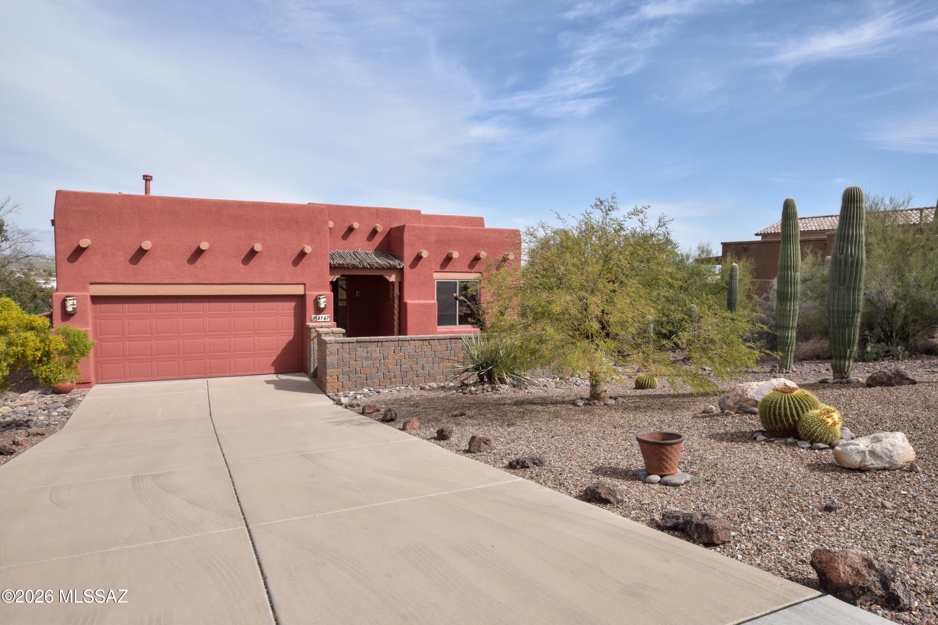 Stunning Santa Fe Style Home with Breathtaking Mountain Views.
Experience the beauty of Tucson in this exquisite 4-Bedroom, 2-Bathroom Santa Fe style home boasting 1,917 sq ft of elegant living space. Perched on an elevated lot, this custom-built gem offers panoramic mountain vistas from nearly every room. Step into a world of natural light and soaring ceilings, where hardwood and tile floors flow seamlessly throughout. The heart of the home is a spacious great room, perfect for entertaining or relaxing while enjoying the corner gas fireplace. The gourmet kitchen is a chef's dream, featuring a breakfast bar, 5-burner gas stove, stainless steel appliances, and custom granite countertops with a matching backsplash. Rich oak cabinets provide ample storage. Retreat to the primary bedroom, where mountain views greet you each morning. Three additional bedrooms offer comfort and privacy for family or guests. A full-size washer and dryer add convenience to your daily routine.
Outside, a paved and enclosed front entry welcomes you home, while a full-length patio showcases stunning views to the East and North. The elevated and private yard space is perfect for outdoor living and entertaining.
Additional features include fresh paint throughout, a 2-car garage, and the perfect blend of modern amenities with Santa Fe charm. Located in a desirable Tucson neighborhood, this rental offers the ideal combination of tranquility and accessibility. Don't miss this opportunity to live in a home where every day feels like a vacation.
Solar Panels that will help offset the cost of electricity.

Monthly landscaping and pest control are included in rent.

This home is offered as NON-SMOKING. Tenants with small dogs under 30 lbs will be considered, Large Dogs and Cats will not be considered.